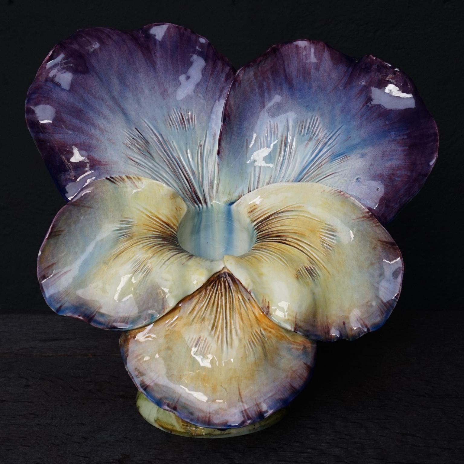 Very large French Majolica or barbotine violet pansy vase
Unsigned but attributed to Delphin Massier.
Look the colors and the detailed painting. Its size and the way the leaves are formed are spectacular.

In 1860 the Massiers began to produce