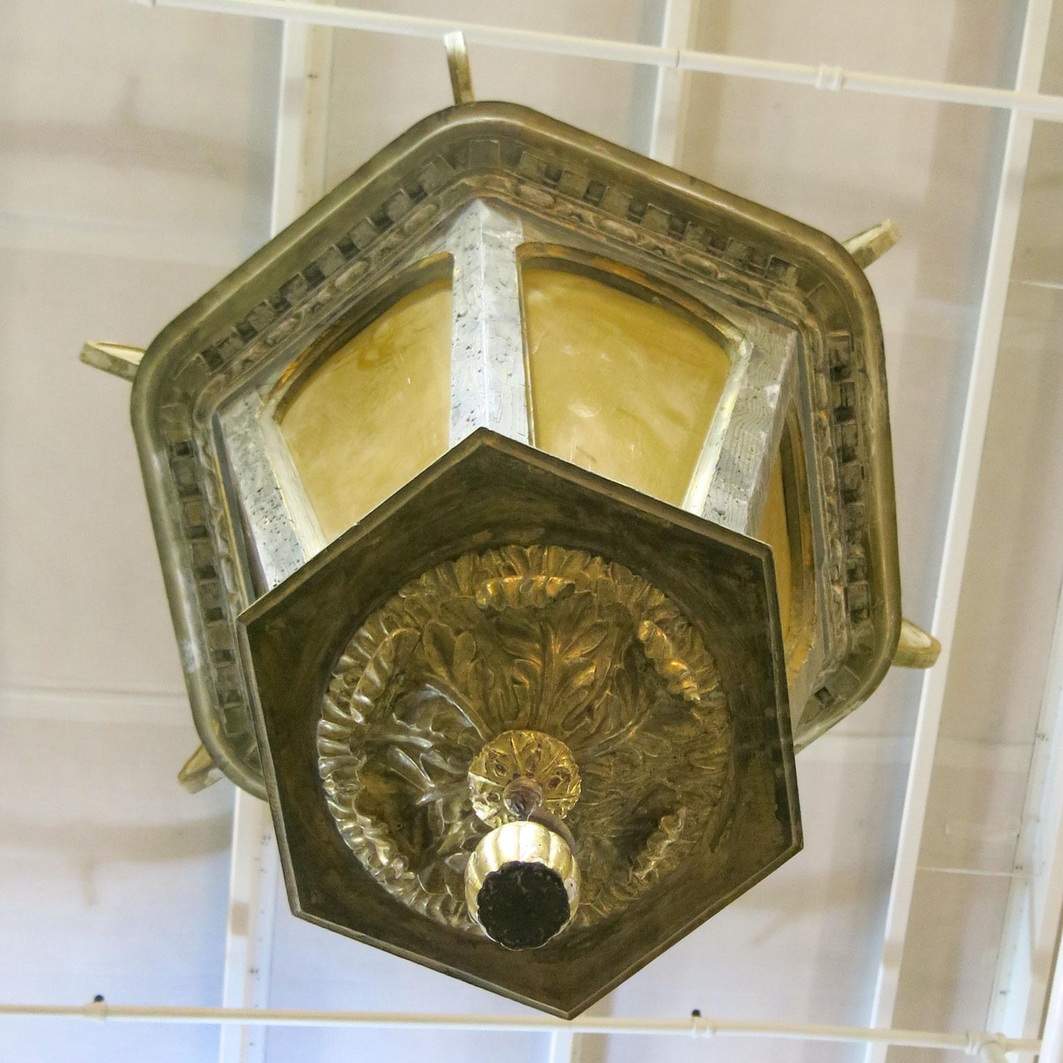 This is an Italian carved wood lantern chandelier. The size is very large and more impressive in person. It has a worn out painted finish, some white and some a rich blue grey. There is a subtle gold on the top scrolls. This has been electrified