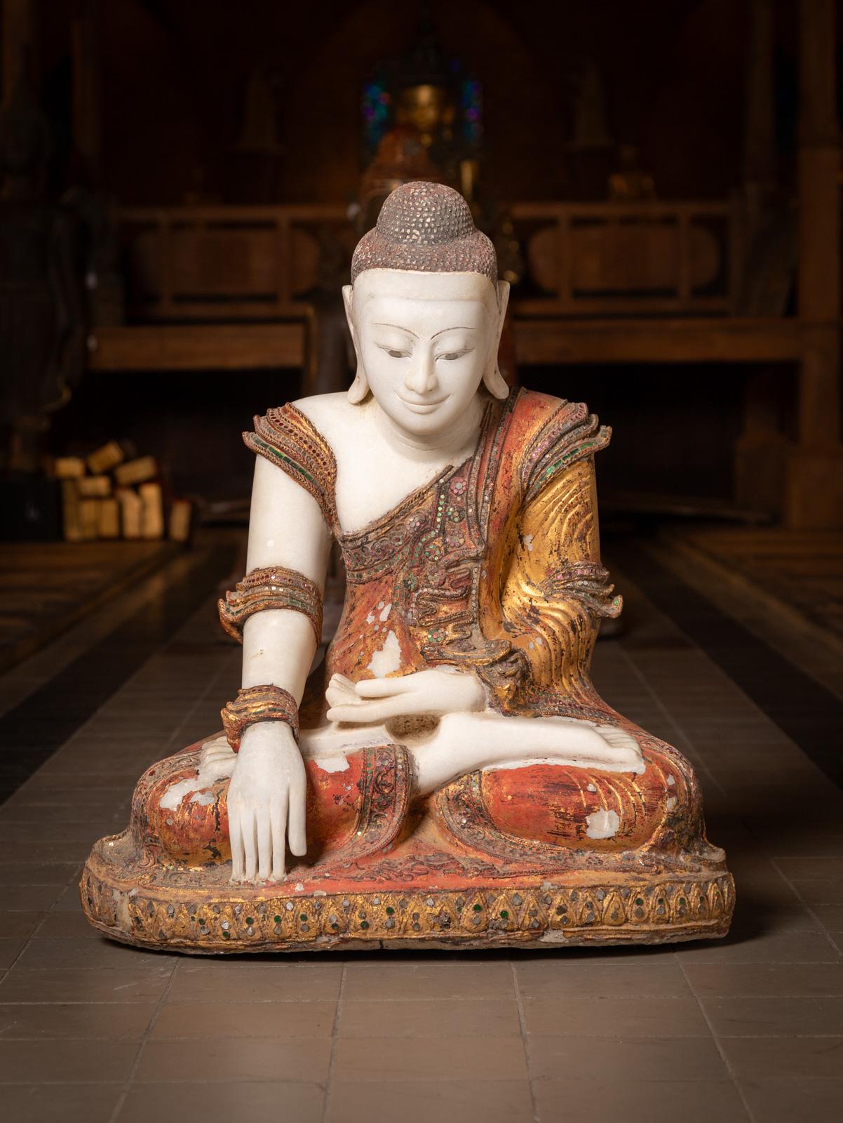Introducing this very special marble Burmese Buddha statue, an exquisite 19th-century artifact crafted in the elegant Mandalay style. Made from solid marble, it retains its original lacquer and rich 24 karat gilding, showcasing exceptional