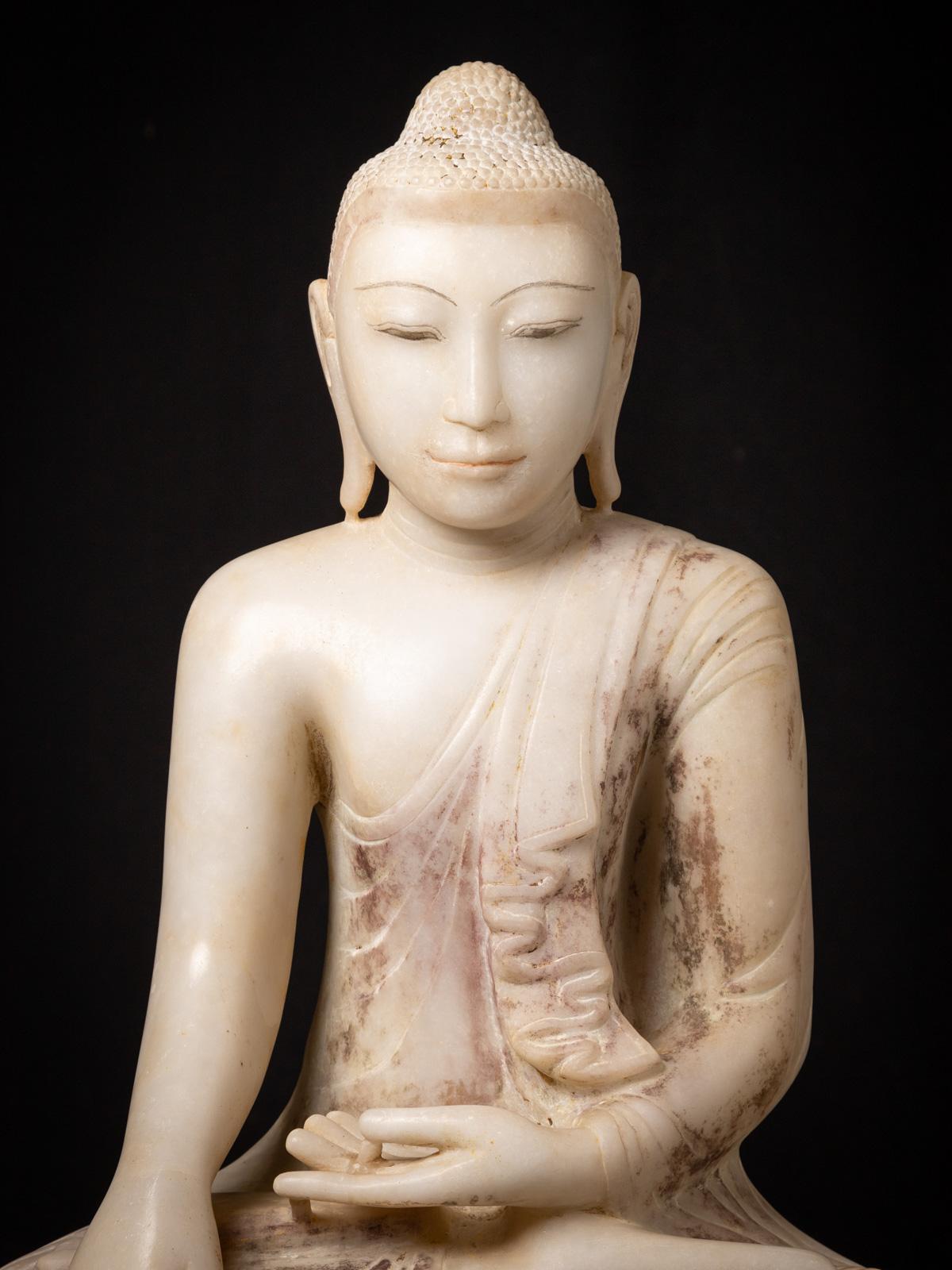 This antique Very special marble Burmese Buddha statue
 is a magnificent. Crafted from marble, it stands at an impressive height of 77 cm and has dimensions of 48 cm in width and 33 cm in depth. 

The statue is depicted in the Bhumisparsha mudra, a