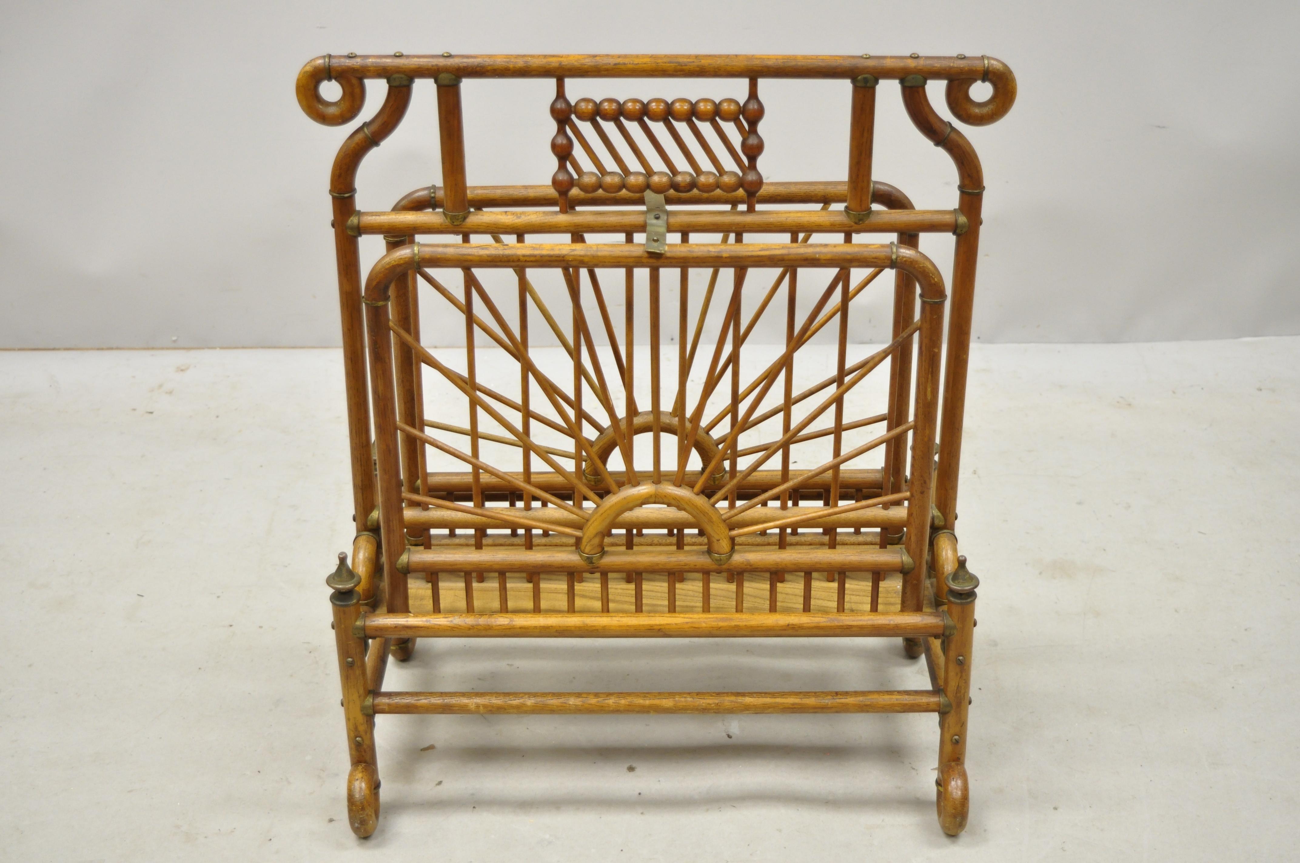 19th century Victorian antique bentwood stick and ball drop side magazine rack. Item features brass accents, oak bentwood frame, drop sides, very nice antique item, circa late 19th century. Measurements: 25
