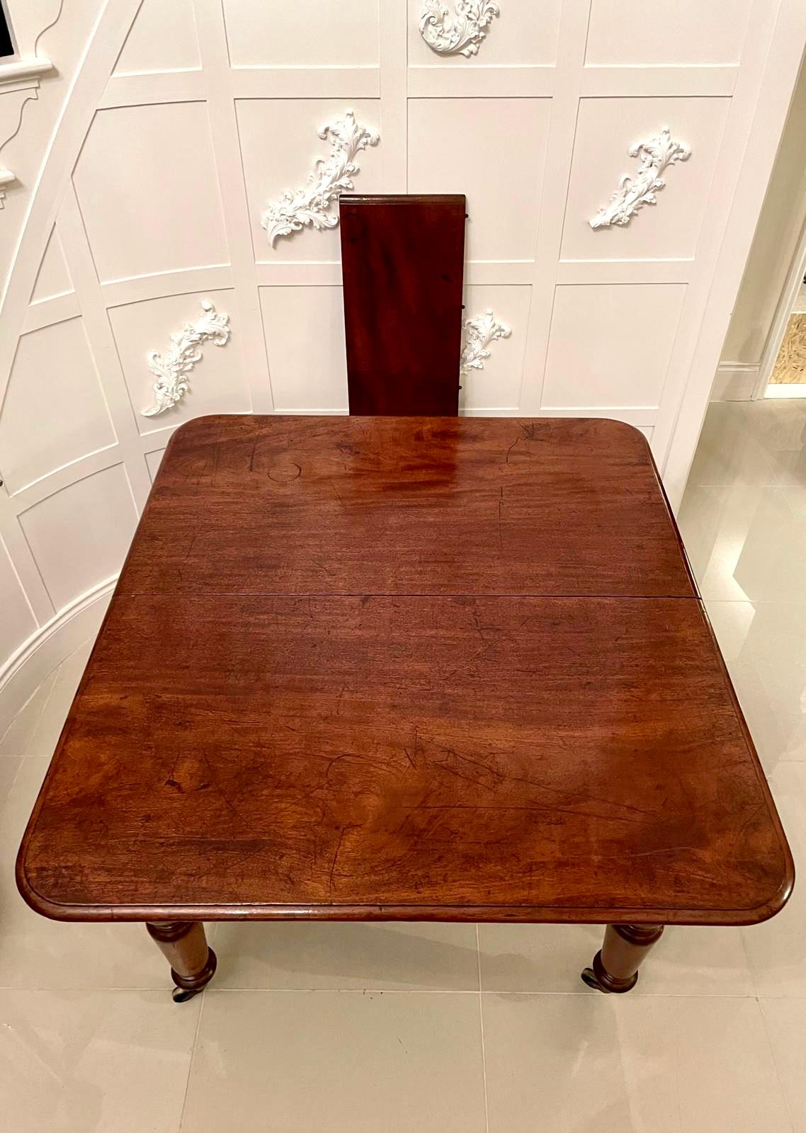 19th century Victorian antique mahogany extending dining table having a quality mahogany extending top with a moulded edge, one large original extra leaf, pull out action and standing on attractive shaped turned legs with original castors.

This