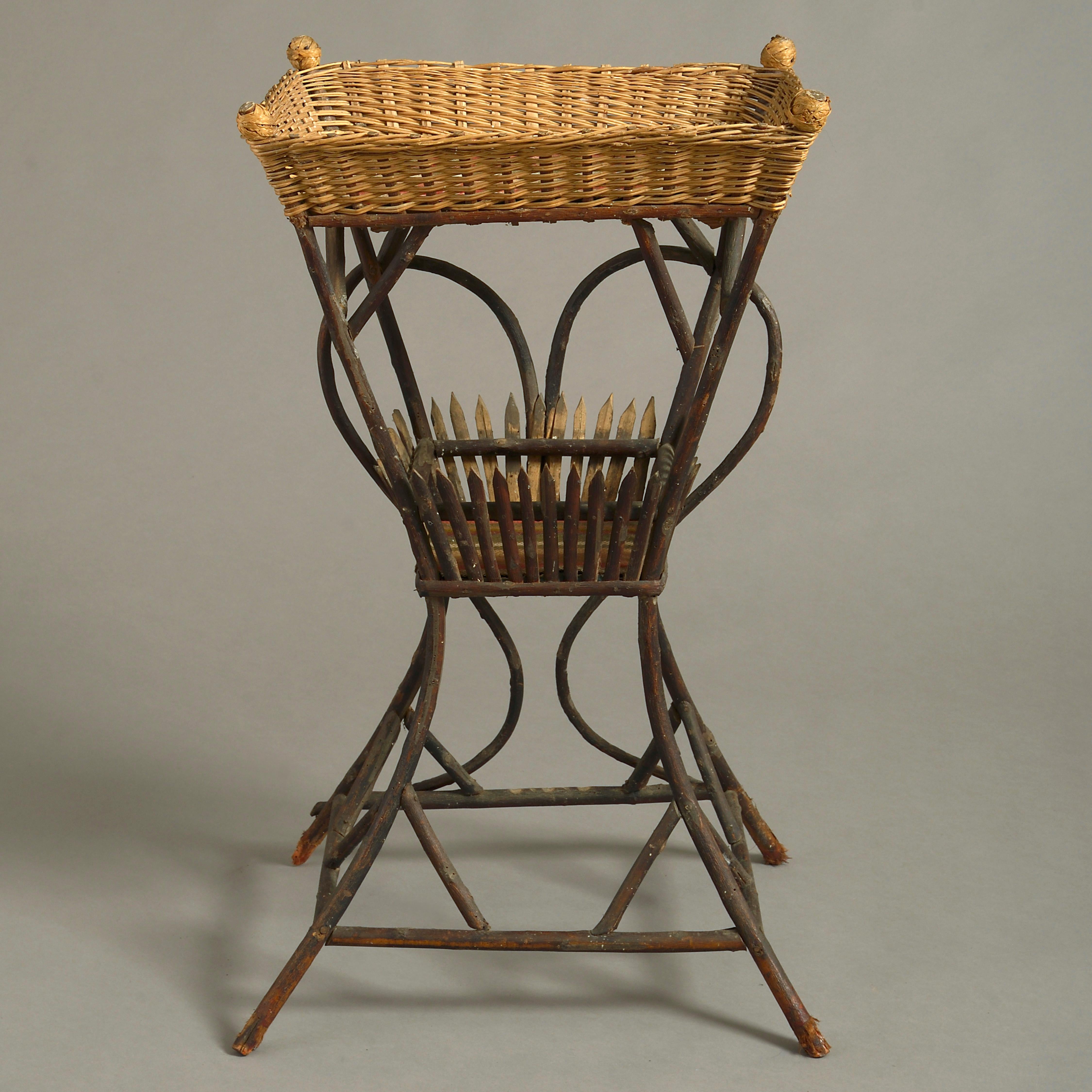 An unusual 19th century occasional table, having a wicker work tray top, with tartan lining, set upon a canework stand.