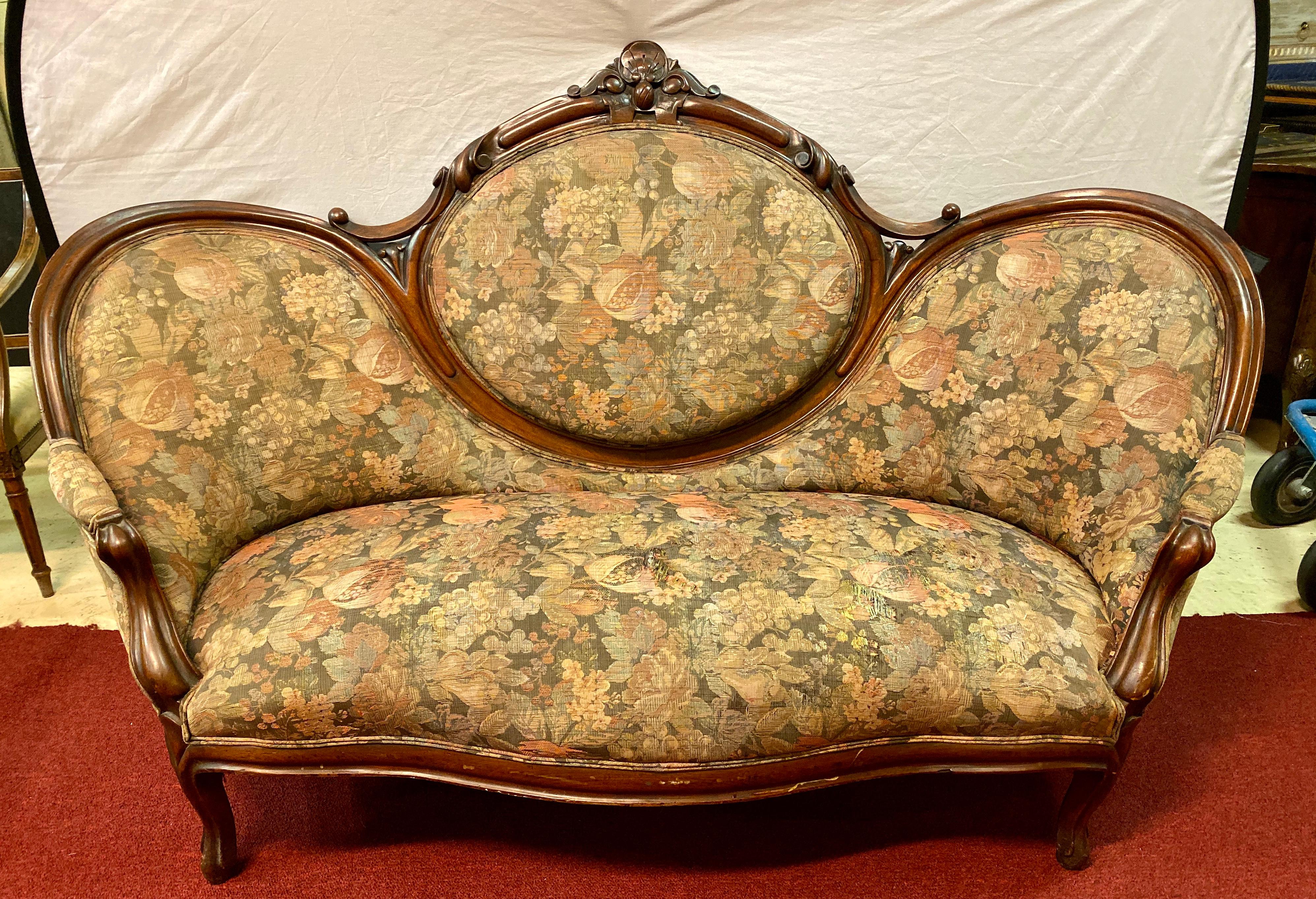 Victorian belter style canopy or loveseat sofa. The frame in fine condition the fabric faded to age in front with a small tear that has been photographed in the last picture. The listed price should more than cover new upholstery.

   