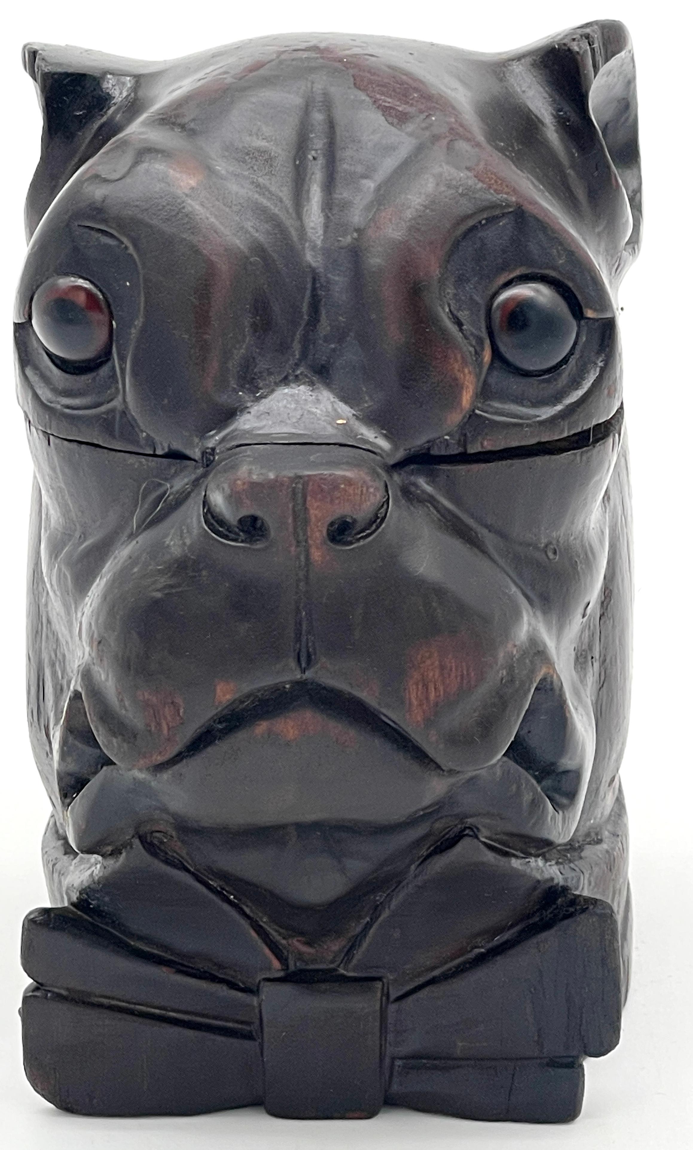 19th Century Victorian Blackened Lignum Vitae Bull/Pug Dog with Bow Tie Inkwell
England, circa 1880s

Presenting a remarkable 19th-century Blackened Victorian Lignum Vitae Bull/Pug Dog Inkwell, originating from England and dating back to the 1880s.