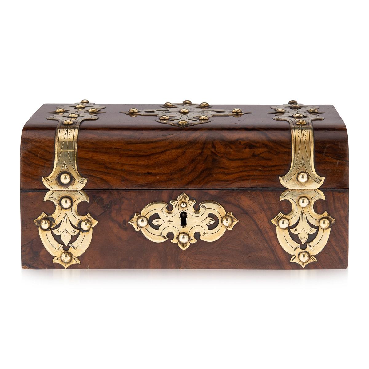 A superb antique Victorian burr walnut casket or jewellery box with elaborate decorative pierced cut brass mounts, circa 1860 in date. The interior is fitted with a lift-out tray and lined in purple velvet, ready to store trinkets or jewellery of