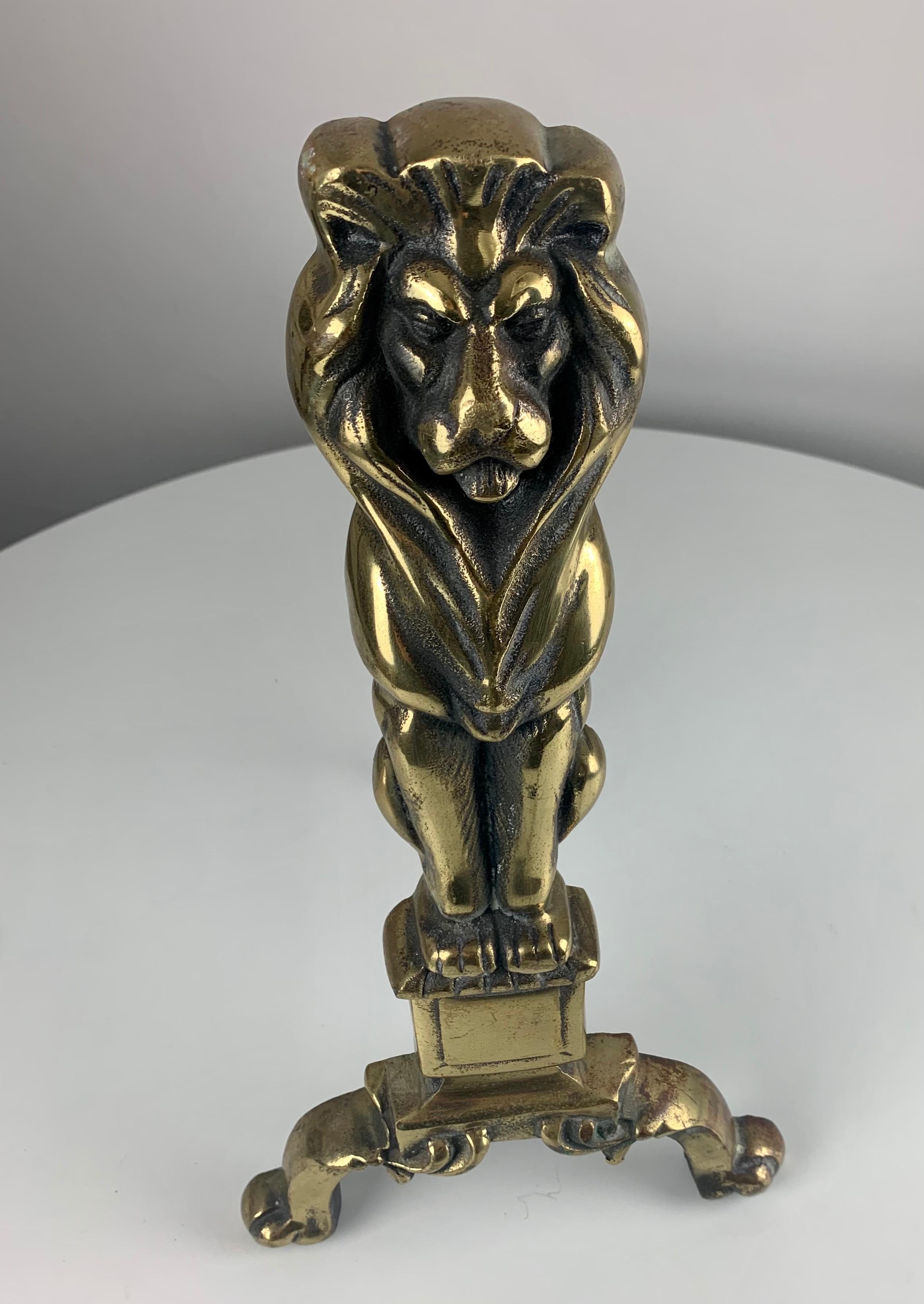 A pair of 19th century Victorian polished brass lion head fire dogs andirons
fine detail and good casting.

Dimensions:
Height of dogs 17 inch
Height of arms 4 inch
Depth external 10 inch
Depth internal 9 inch
Base width 9.5 inch
Top width