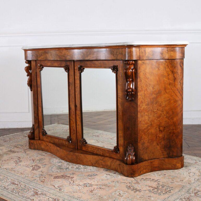 Introducing a captivating 19th Century Victorian Burl Walnut Credenza. Crafted with meticulous attention to detail, this antique piece showcases the timeless beauty of burl walnut wood. Its rich patterns and warm tones create a mesmerizing visual