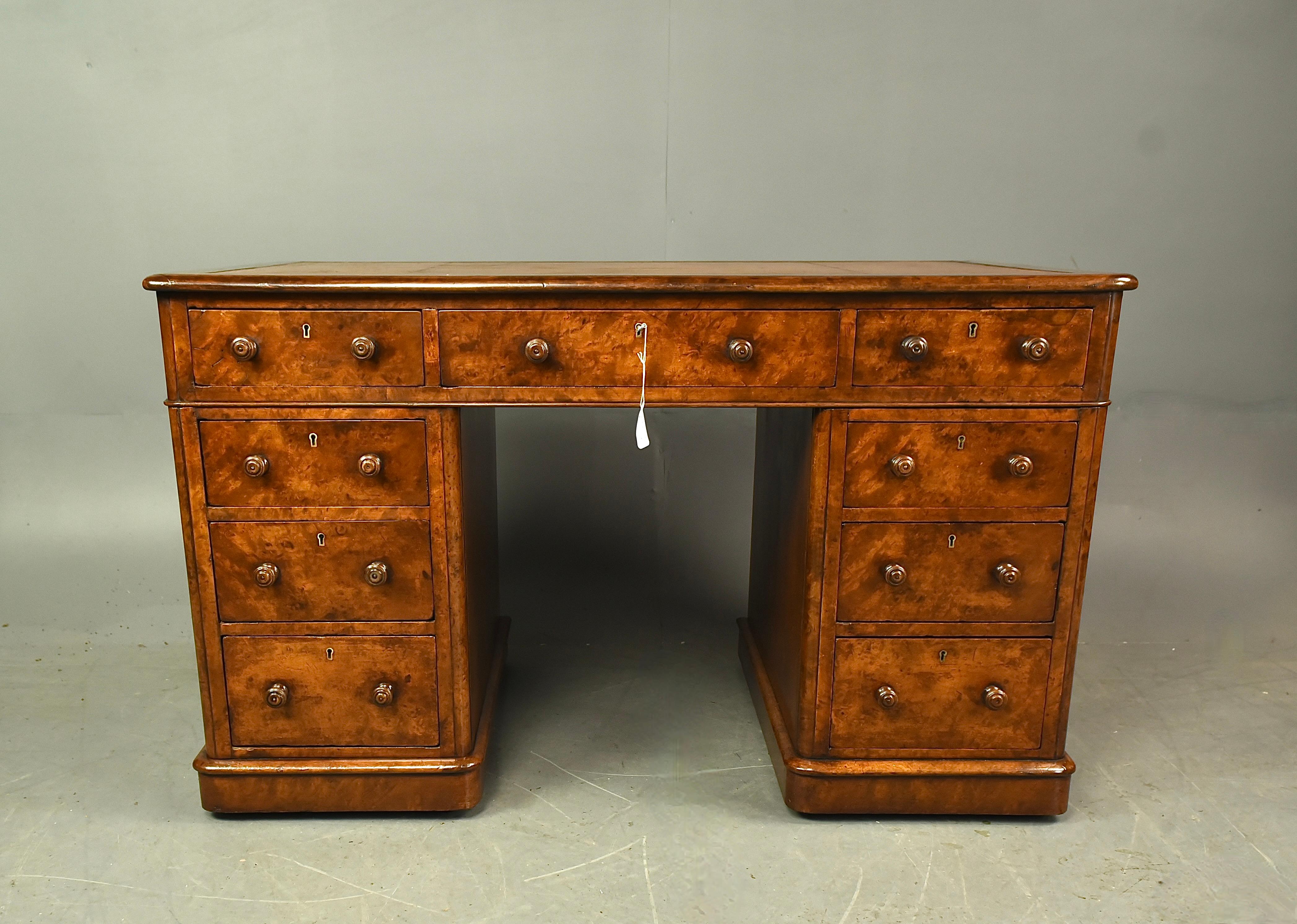 Fine quality Victorian burl walnut pedestal desk circa 1870 .
The desk has a fantastic grain and colour with a wonderful patina .
It has 9 hand dovetailed mahogany lined drawers ,The central top drawer has a working lock and key .
The top has a