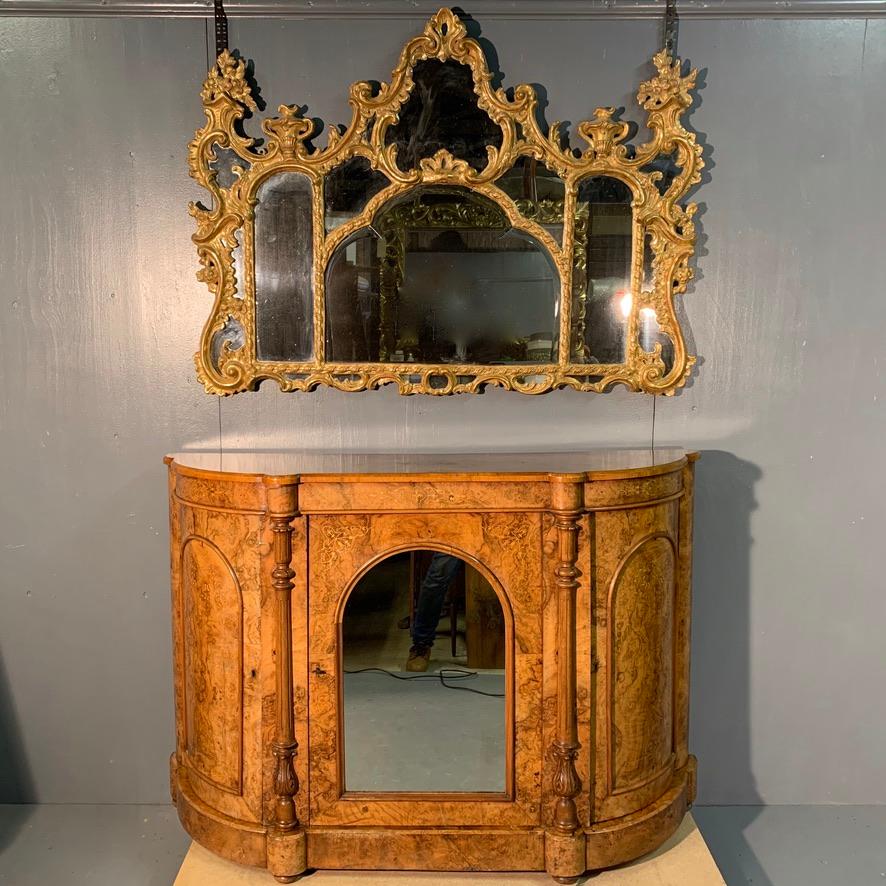 Unusual full burr walnut and marquetry Victorian credenza sideboard with central mirrored door.
Fabulous color to the burr walnut and with this being a smaller proportioned piece, makes it a very easy piece to place, perhaps as a hall console