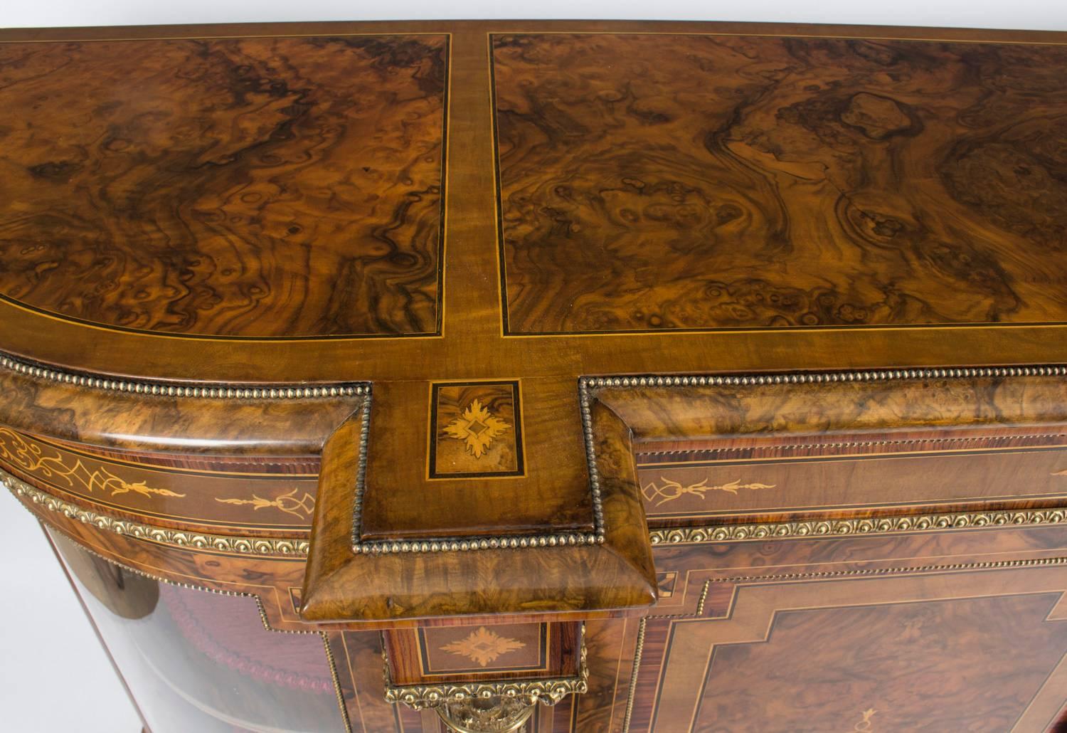 This is a superb quality antique Victorian burr walnut and inlaid credenza, circa 1860 in date.

The entire piece highlights the unique and truly exceptional pattern of the burr walnut extremely well and the walnut is complimented by the elegant