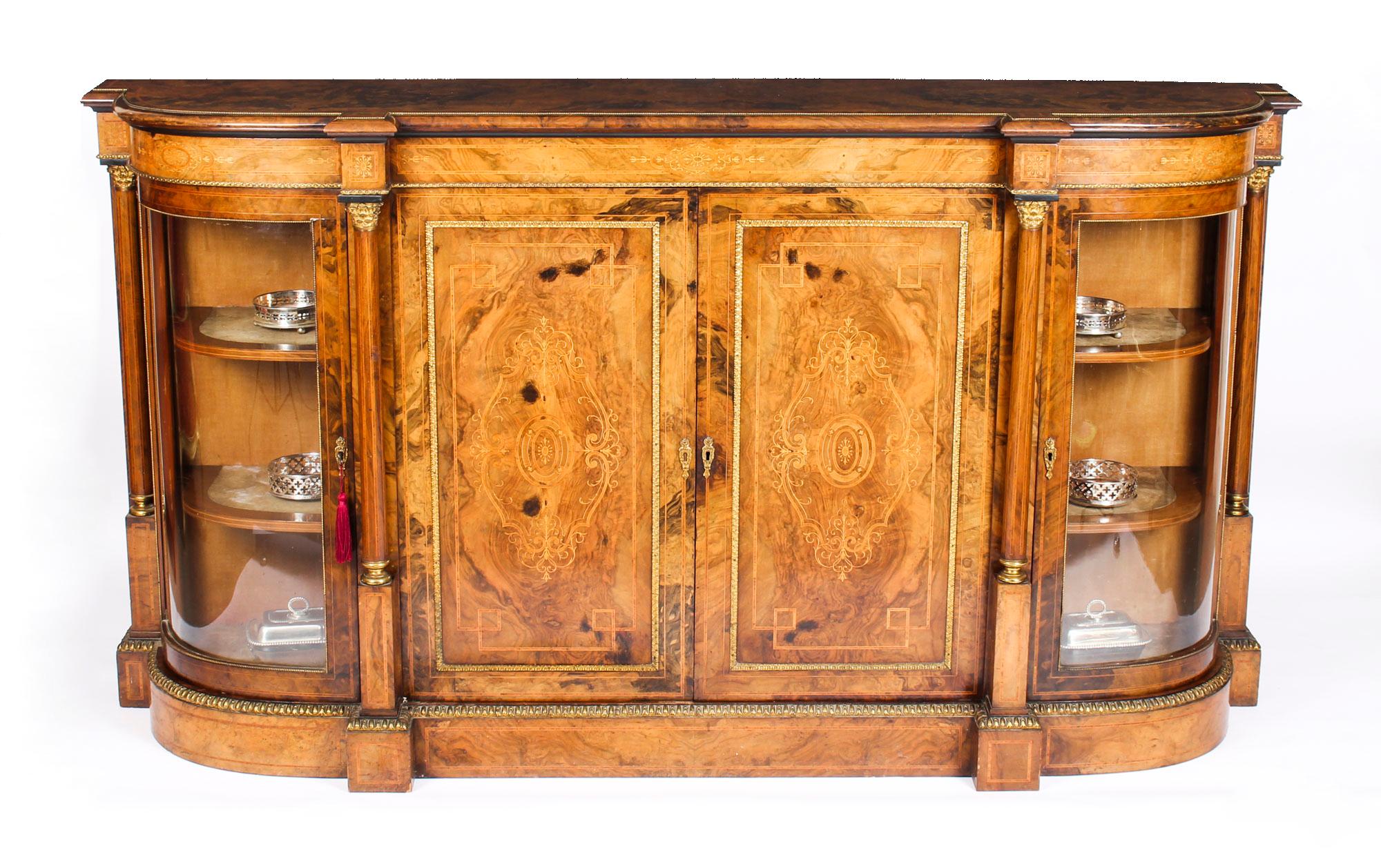 This is a superb quality antique Victorian burr walnut and inlaid credenza, circa 1860 in date.

The entire piece highlights the unique and truly exceptional pattern of the burr walnut extremely well and the walnut is complimented by the elegant