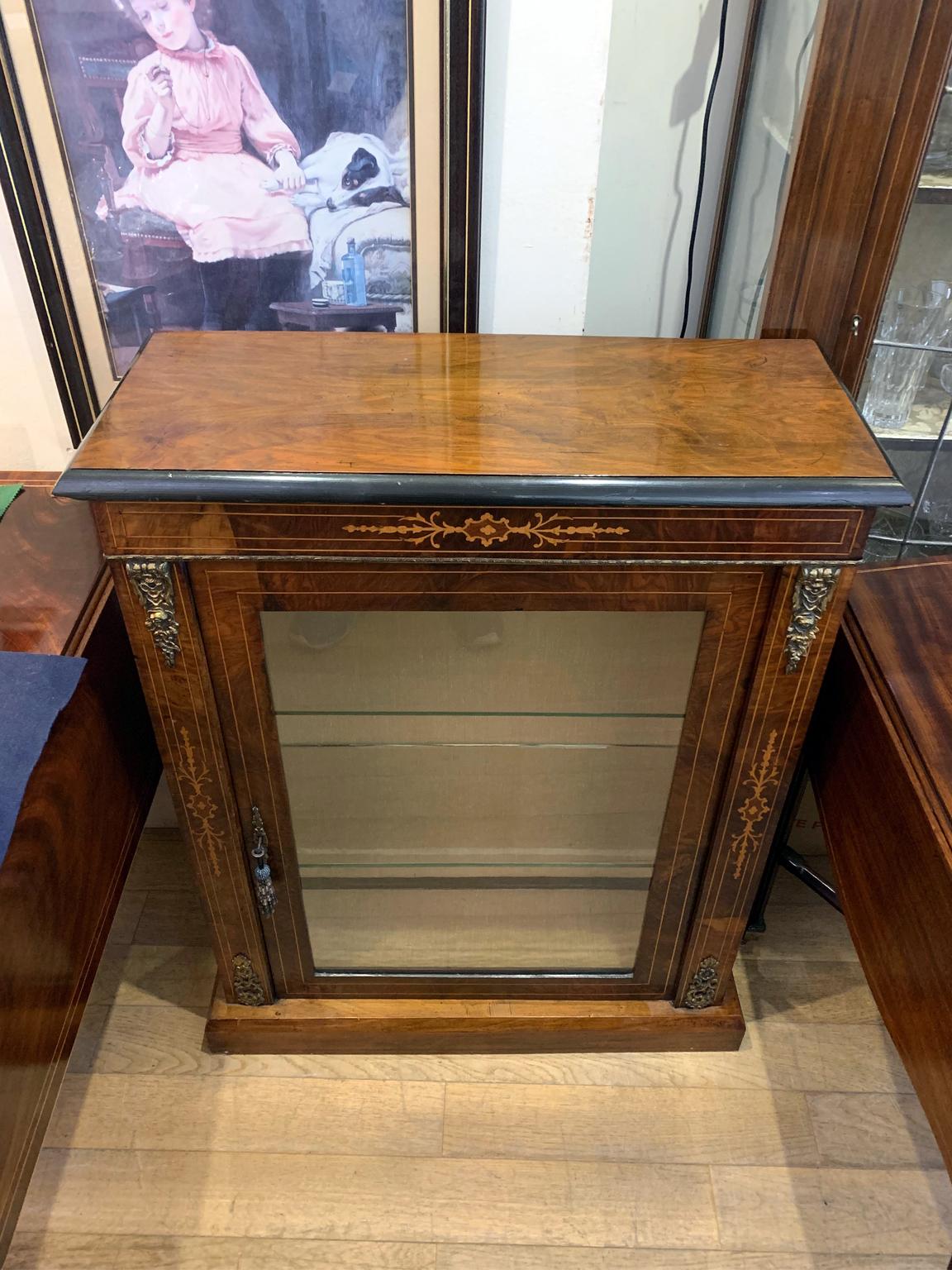 19th Century Victorian mahogany inlaid pier cabinet with three original glass shelves and working key.

