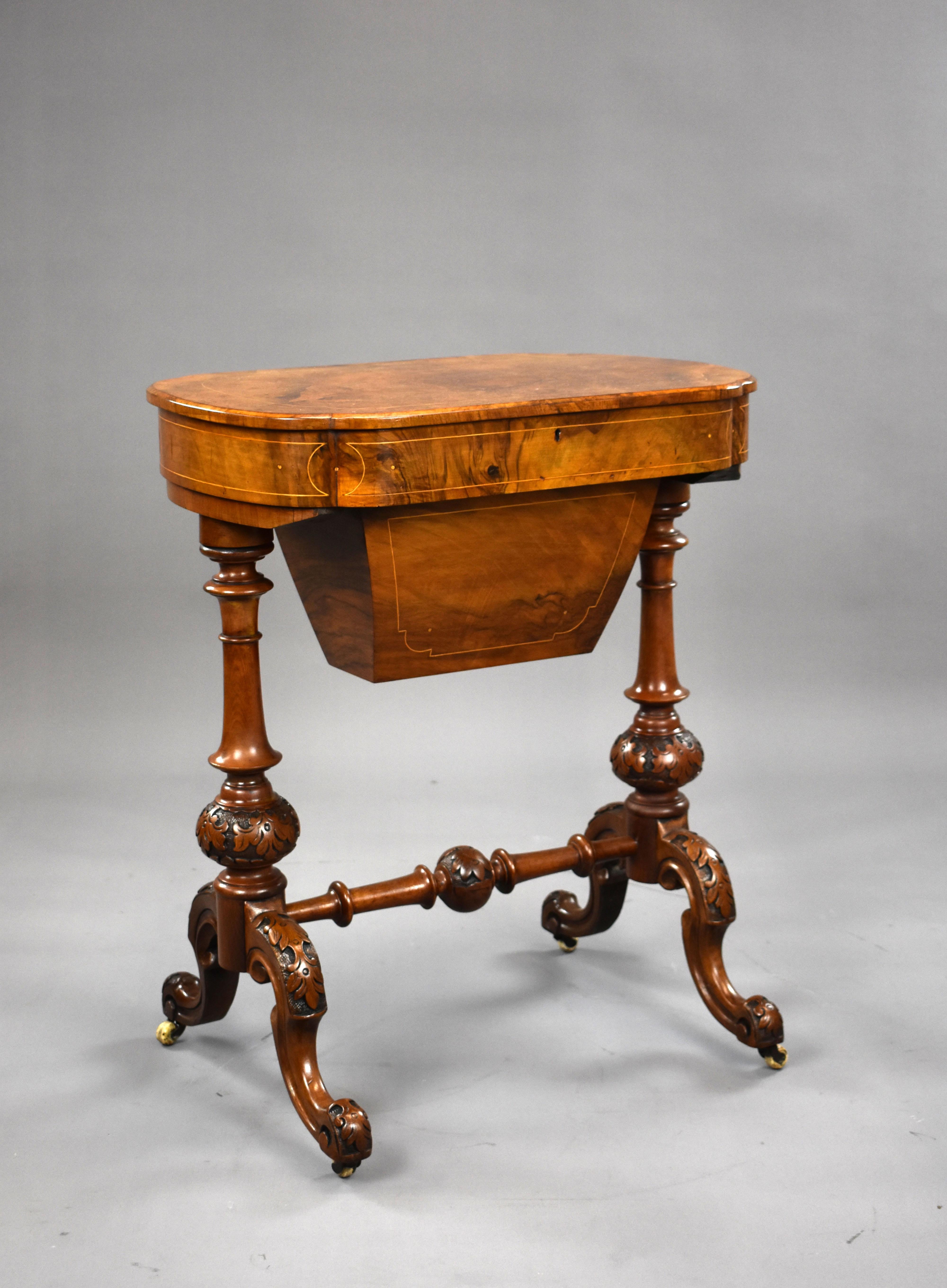 A good quality Victorian burr walnut work table, the rising lid opening to a fully fitted interior, above ornately turned and carved legs unite by a stretcher. This table is in excellent condition for its age. 

Measures: Width: 60cm depth: 39cm