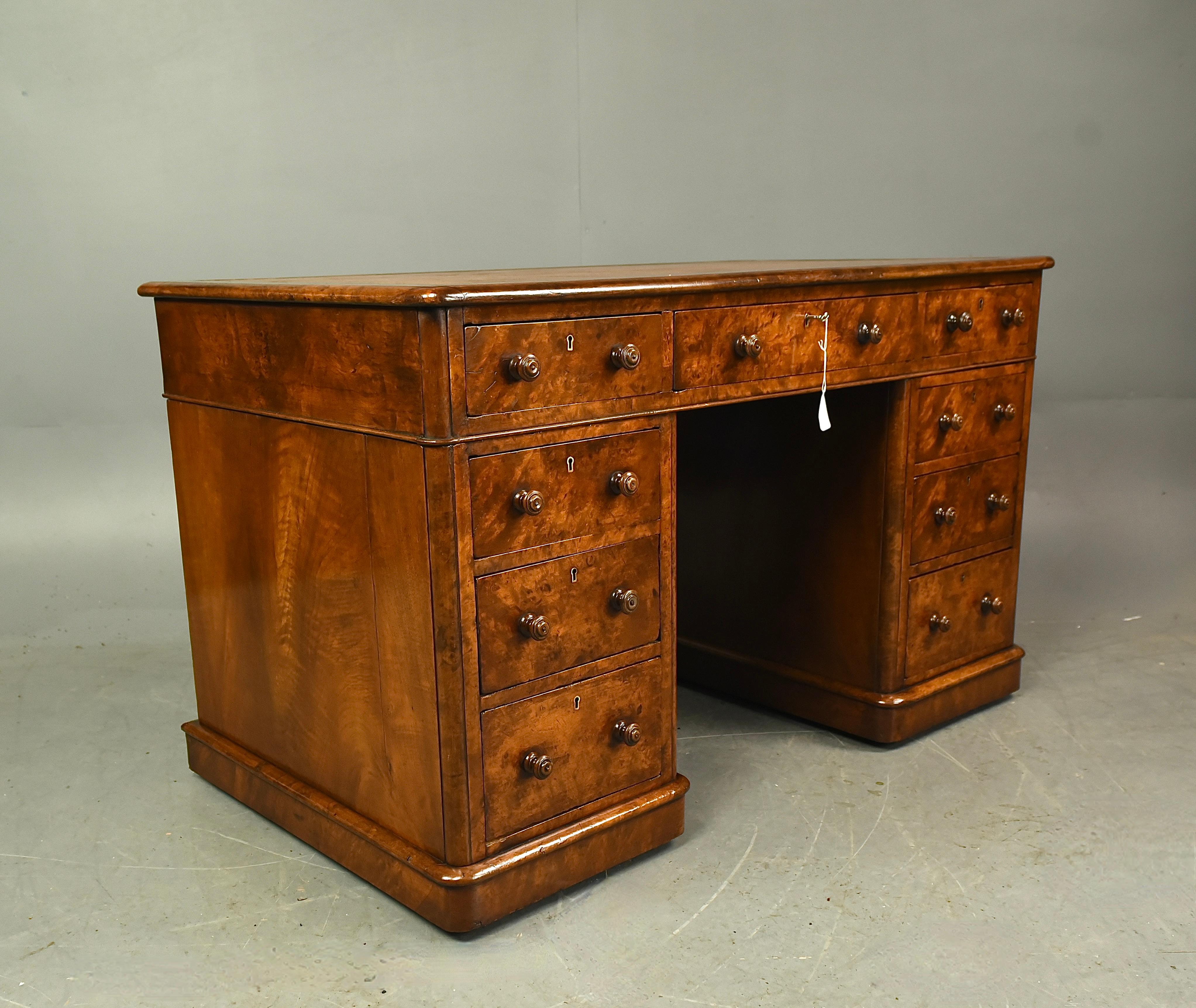 Fine quality Victorian burr walnut pedestal desk circa 1860 .
The desk has 9 drawers , the centre drawer has a working lock and key .and all drawers are solid in joint and slide nice and smooth as they should .The desk has a tan leather insert to