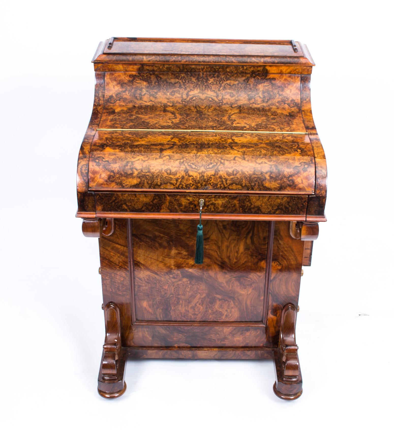 This is a gorgeous antique piano fronted Davenport desk, circa 1860 in date.

It is crafted from fabulous burr walnut and features a beautiful hinged gilt tooled green leather inset.

It has been wonderfully made by a master craftsman, the