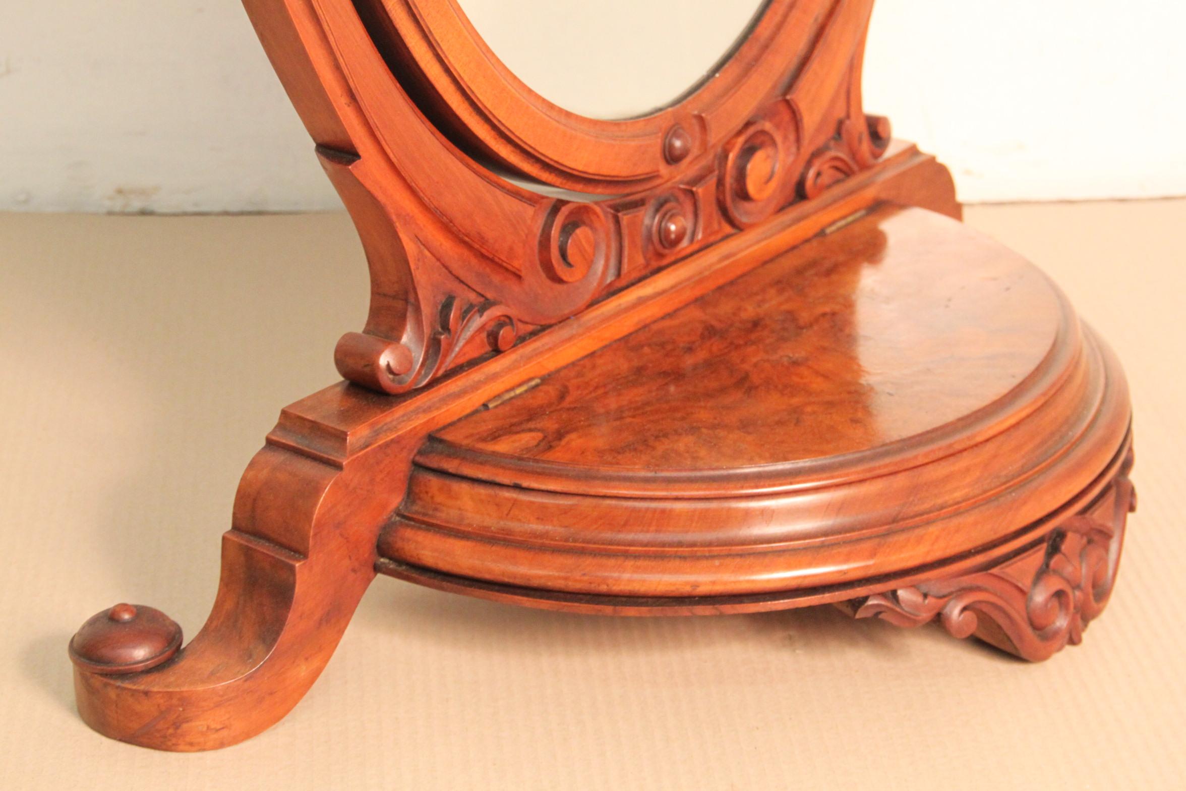 A very good quality Victorian toilet mirror. Made from solid walnut and lovely burr walnut veneers. The mirror is adjustable within the frame. The base section with a lift up top jewelry box. This delightful mirror is offered for sale in very good