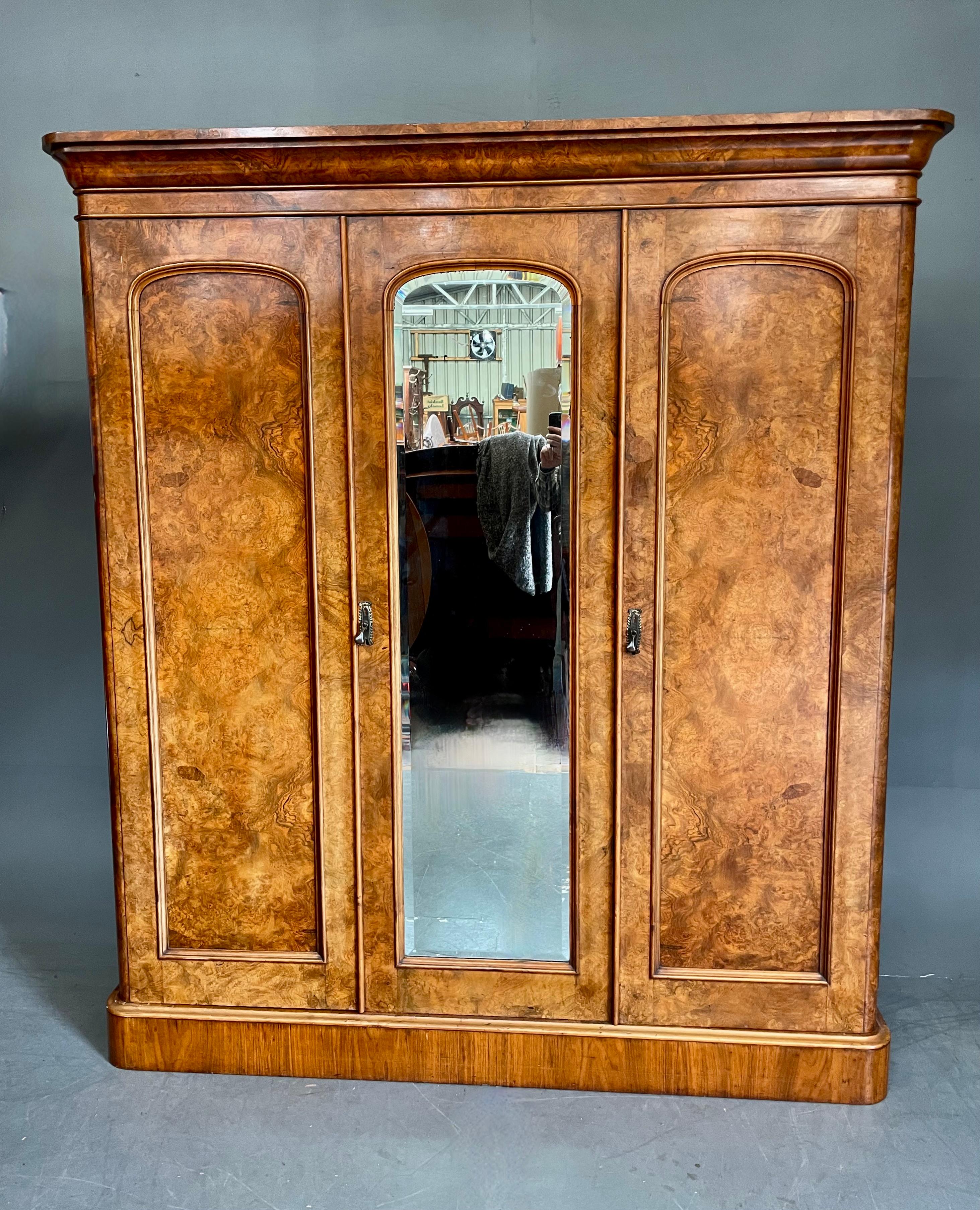 Fine quality Victorian burr walnut triple wardrobe .circa 1860 .
The wardrobe is a fantastic colour with an amazing grain .It is in very good original condition still retaining its original linings .
Each end section has a single hanging rail and