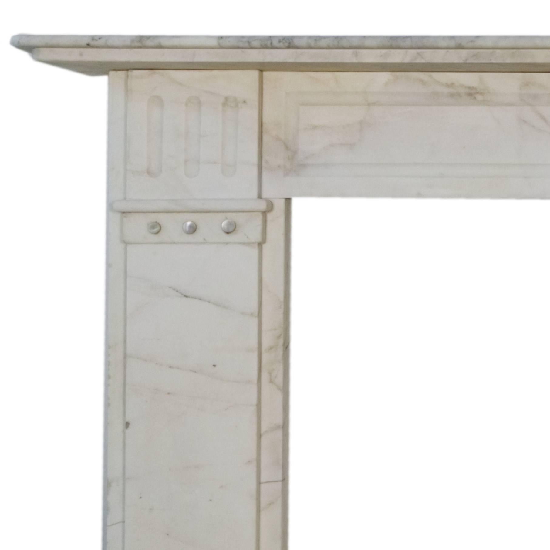 19th century Victorian Carrara marble fireplace mantel, with flutes to upper part of each leg with pearl like circular decorative details and stepped shelf.
Salvaged from a central London terraced town house.

Measure: Shelf width 63 1/8