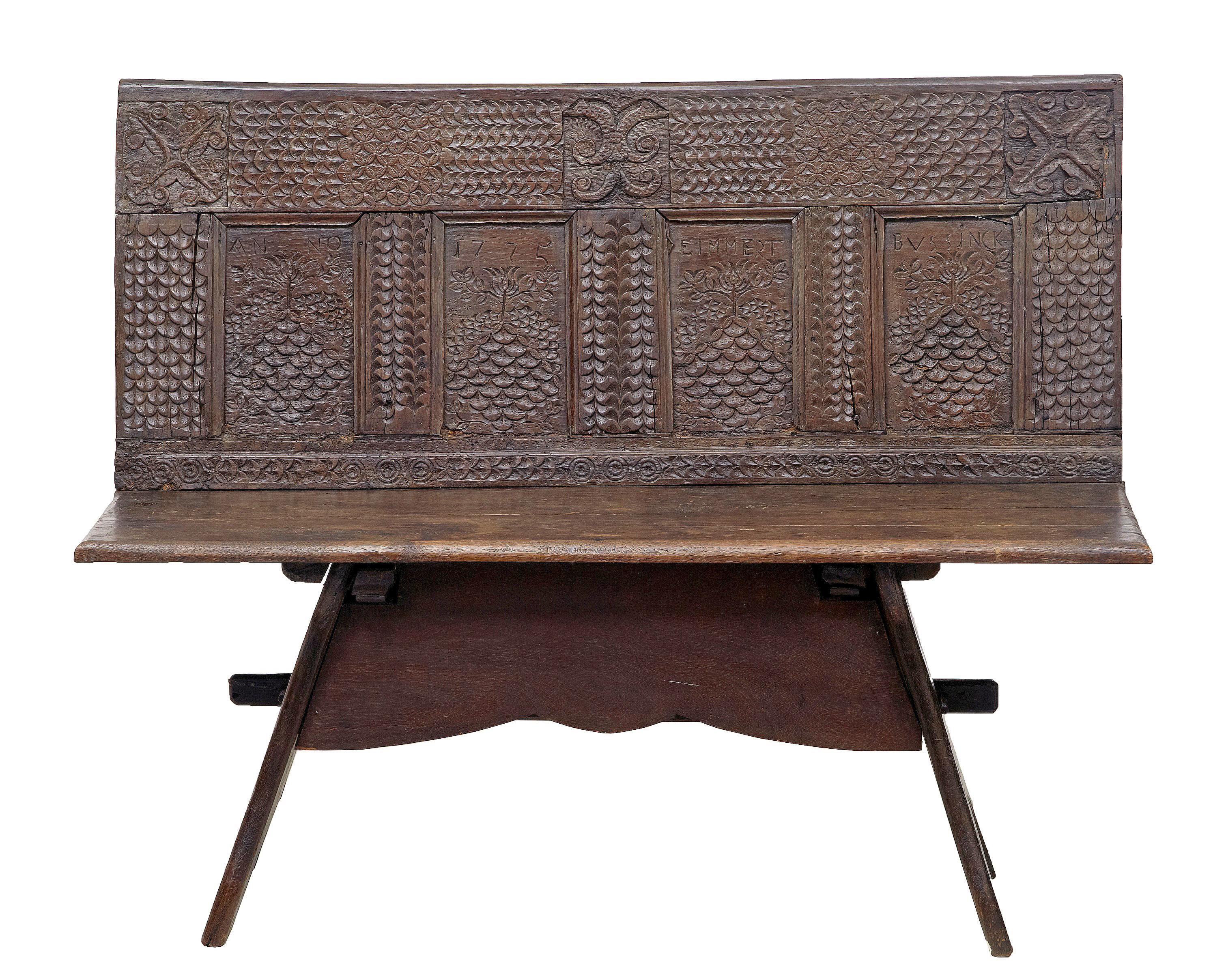 19th century Victorian carved oak bench circa 1880.

Victorian bench made from earlier elements. Pegged base supports elements from an 18th century coffer, which was normal re birth of furniture by the victorians.

Age splits to seat, expected