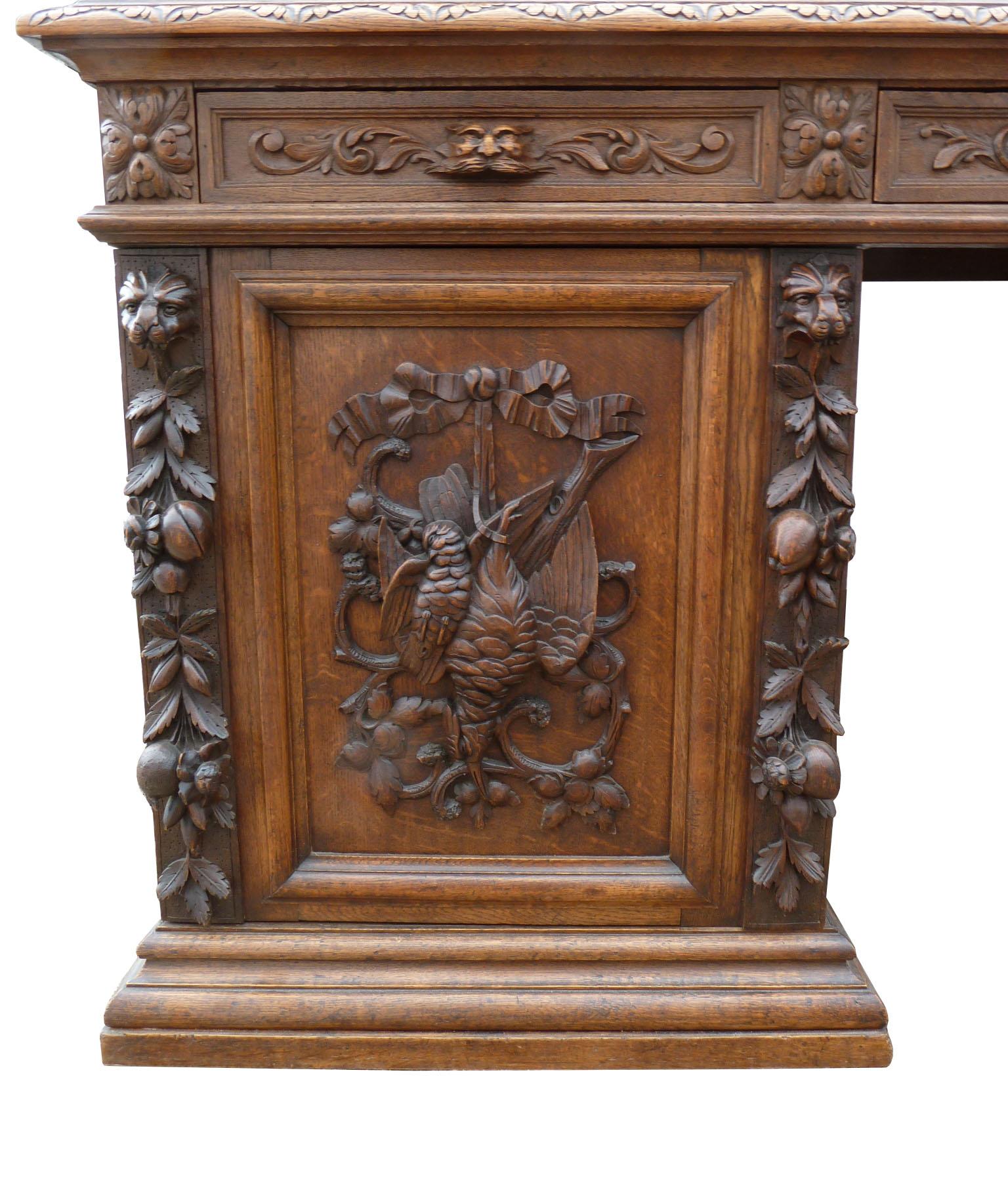 For sale is a flemmish carved oak sideboard. The sideboard has an elaborate mirror back with lion carvings at the top and fruit carvings to the sides. This is above three drawers with two cupboards below. Each cupboard has carvings of animals to the