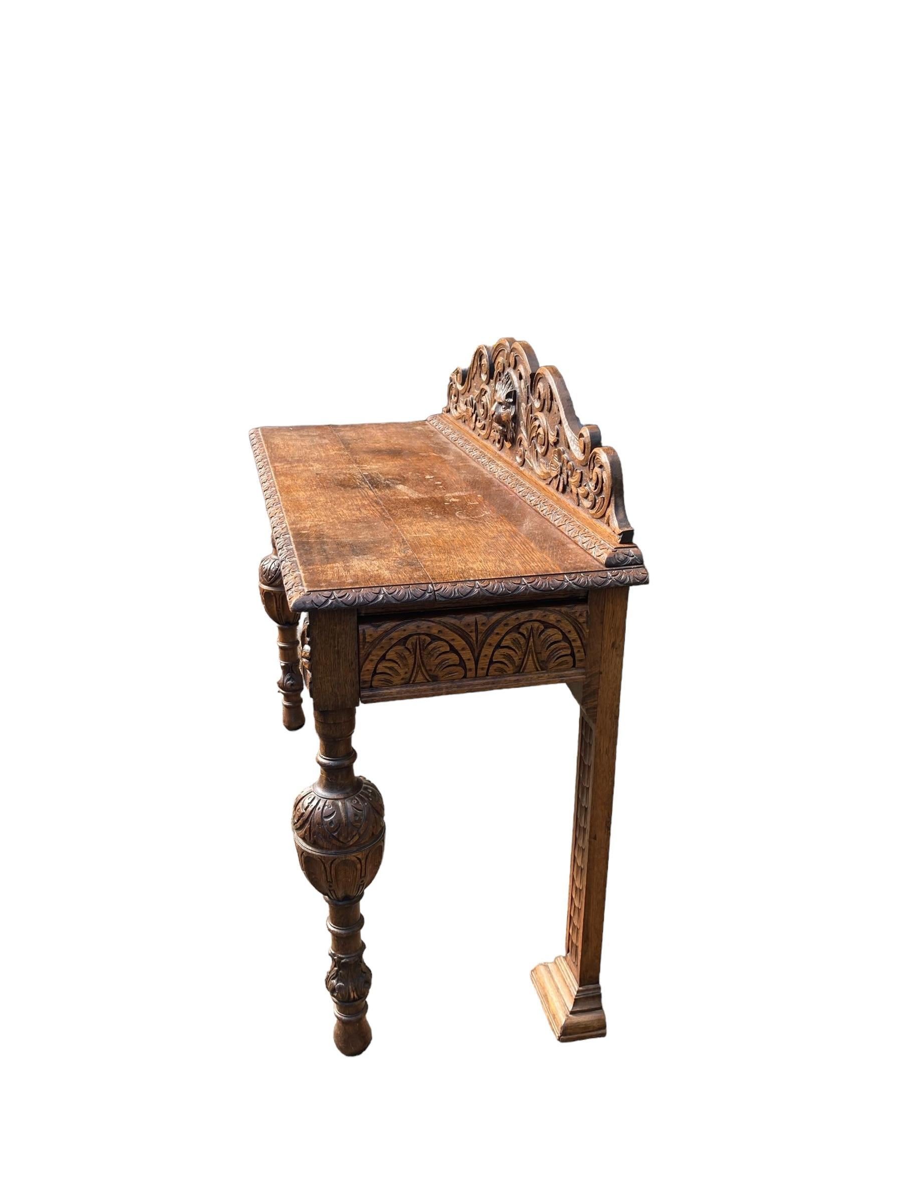 19th Century Victorian Carved Oak Sideboard or Hall Table, Rampant Lions Head Carvings, ornate carved legs, single draw to side. Scottish CIRCA 1860. Finely carve rear upstand. Beautiful colour and grain to the Oak

Whether it's Antique, Art Deco,
