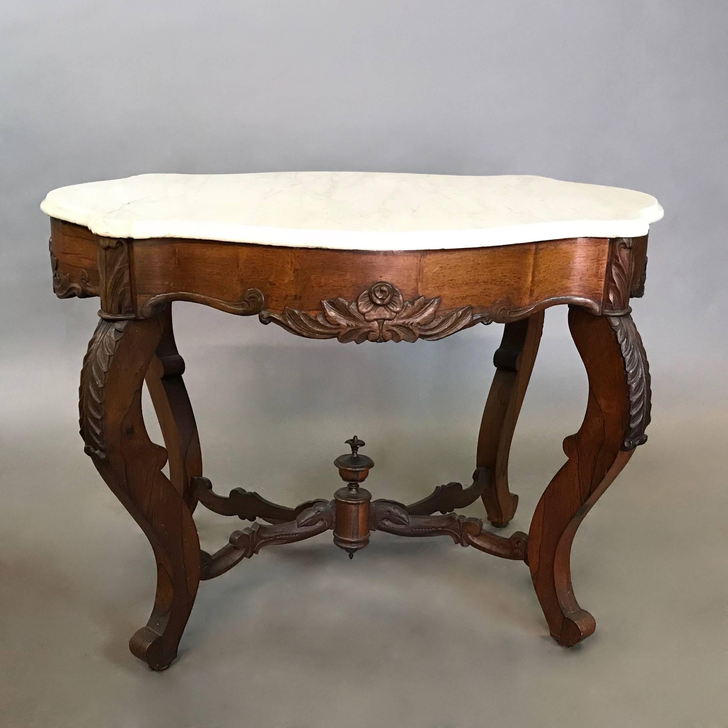 Antique, 19th century, center table features a beautifully carved, rosewood base with cabriole legs, acanthus knees and beveled edge marble top. 