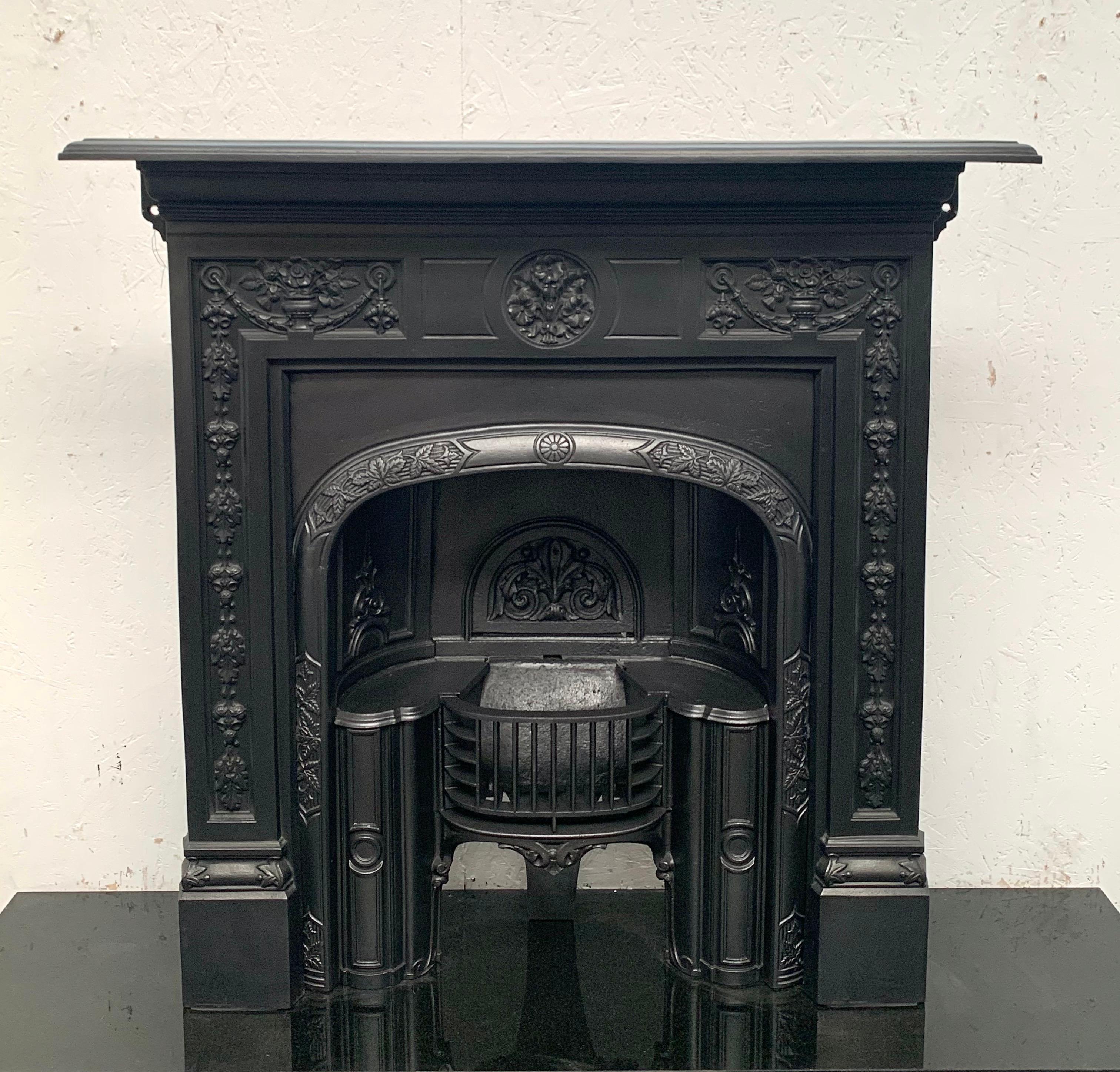 19th century original Victorian cast iron fireplace combionation surround with insert
Traditional blackened finish. British made with good cating details.
Shelf 42
