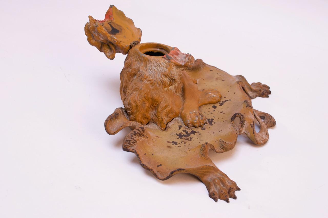 Figural lion inkwell boasting original paint with hinged lion's head concealing the well, circa late 1800s
Patina / paint loss consistent with age / use.