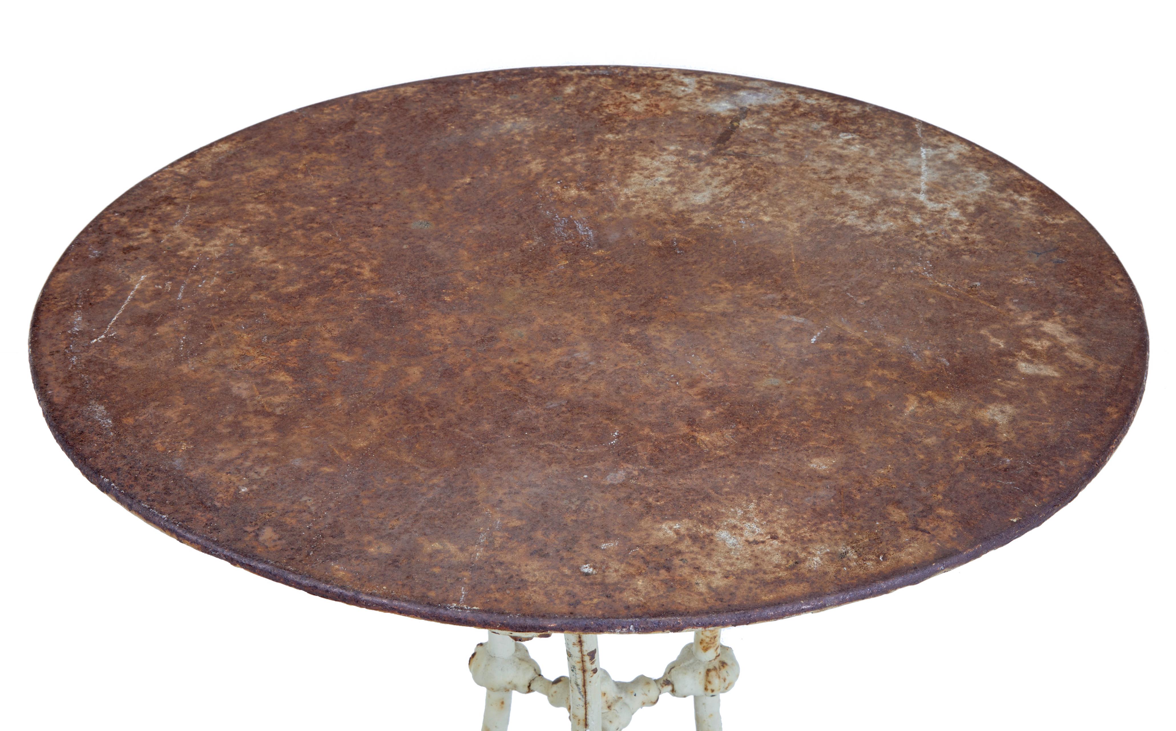 19th Century Victorian cast iron occasional table, circa 1890.

Circular top which has now taken on a desirable rusted appearance, standing on a decorative painted cast iron tripod base.  Ideal for use in a garden room or for any room in the