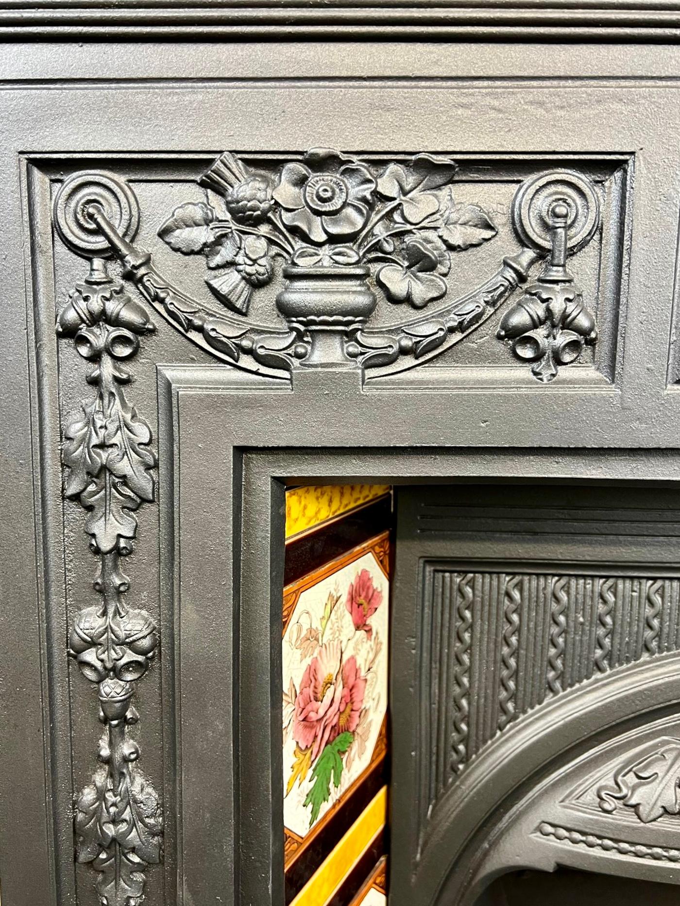 19th Century Victorian Cast Iron Tiled Combination Fireplace.
This Original Antique Fireplace Has A Typical Floral Victorian Designed Pattern, With Original Iron Front Bars, Canopy Hood, Back And Ceramic Hand Painted Victorian Set Of Tiles.