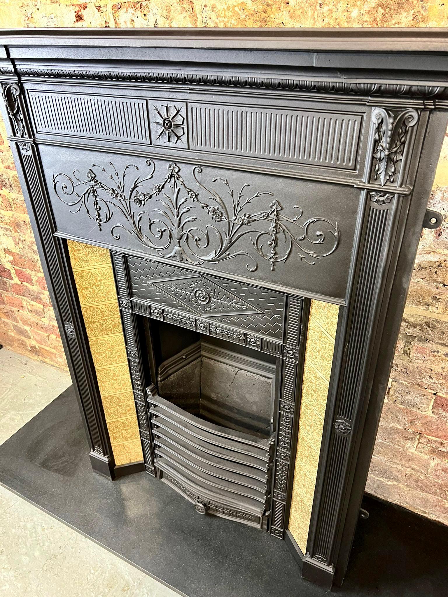 19th Century late Georgian - early Victorian cast-iron tiled combination fireplace.
This antique original fireplace has been recently salvaged from a large london town house, blackened to its original finish. Notably suitable for a smaller chimney