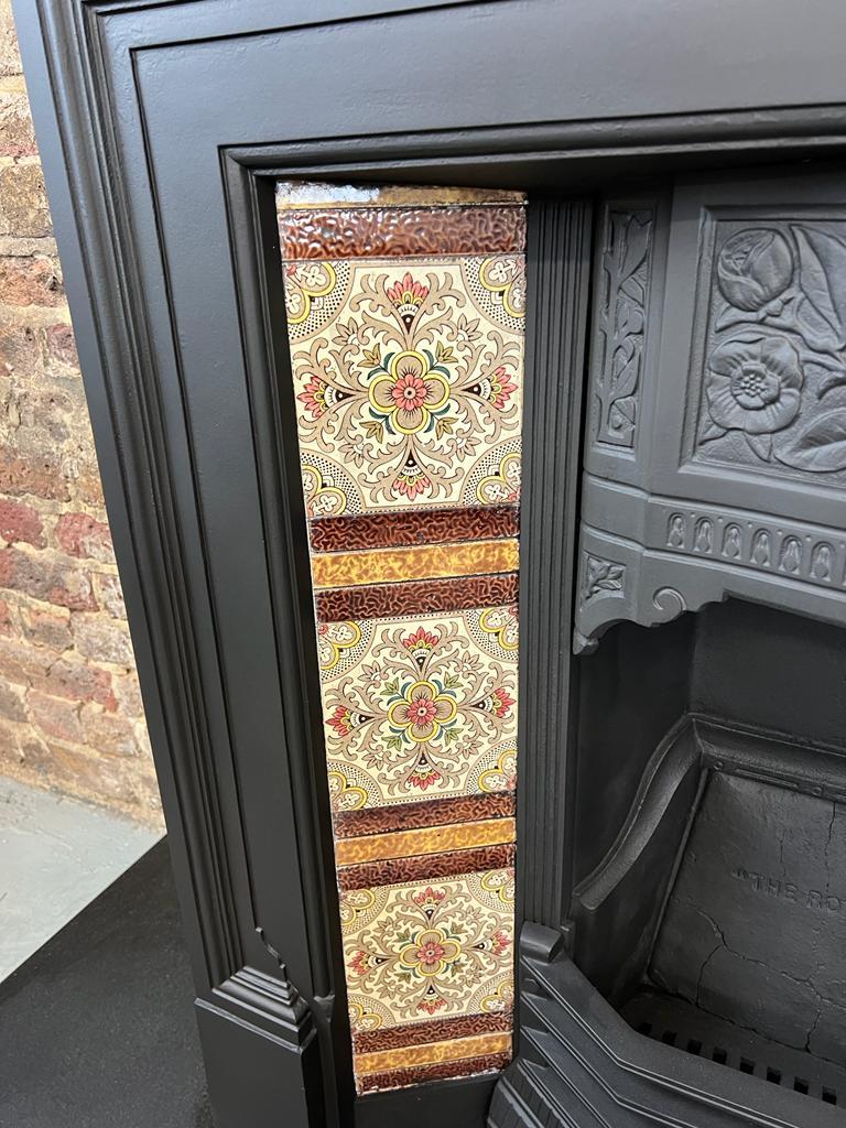 19th Century Victorian cast-iron tiled fireplace combination.
This original 