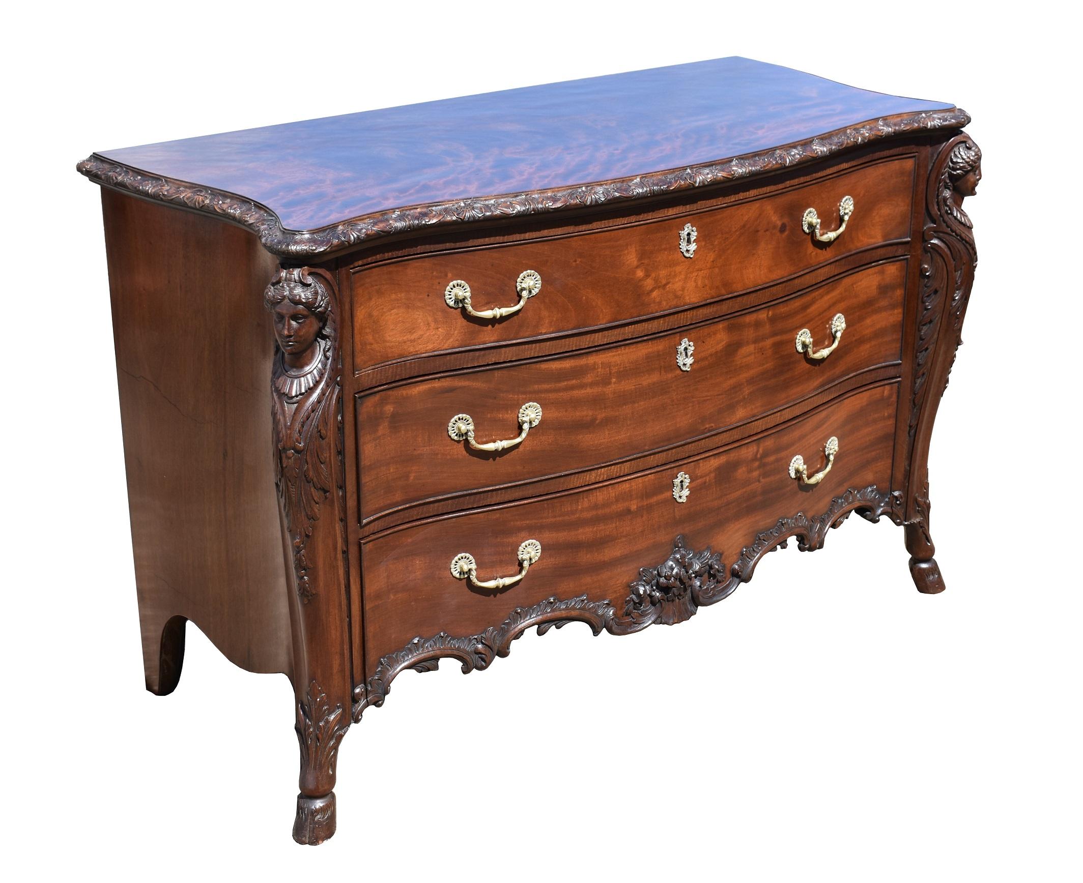 For sale is a fine example of a 19th century Victorian Chippendale style mahogany serpentine chest of drawers. Having a well figured top with a Rococo carved shell edge, with three graduated drawers below, each flanked by carved caryatids and