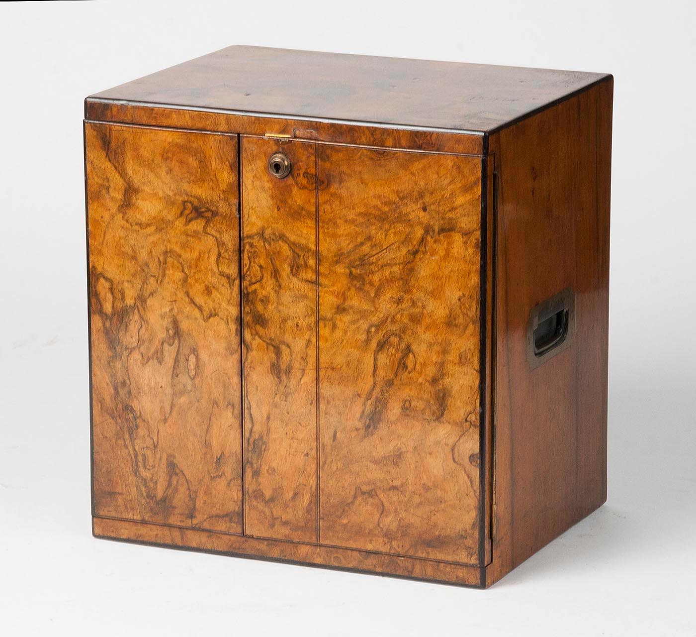 Beautiful Victorian cigar box made from mahogany and burl walnut veneer. The chest has three drawers and recessed copper handles. The lock functions well, it is a pump lock.
The interiors of the drawers are covered with red cedar wood.
Made in