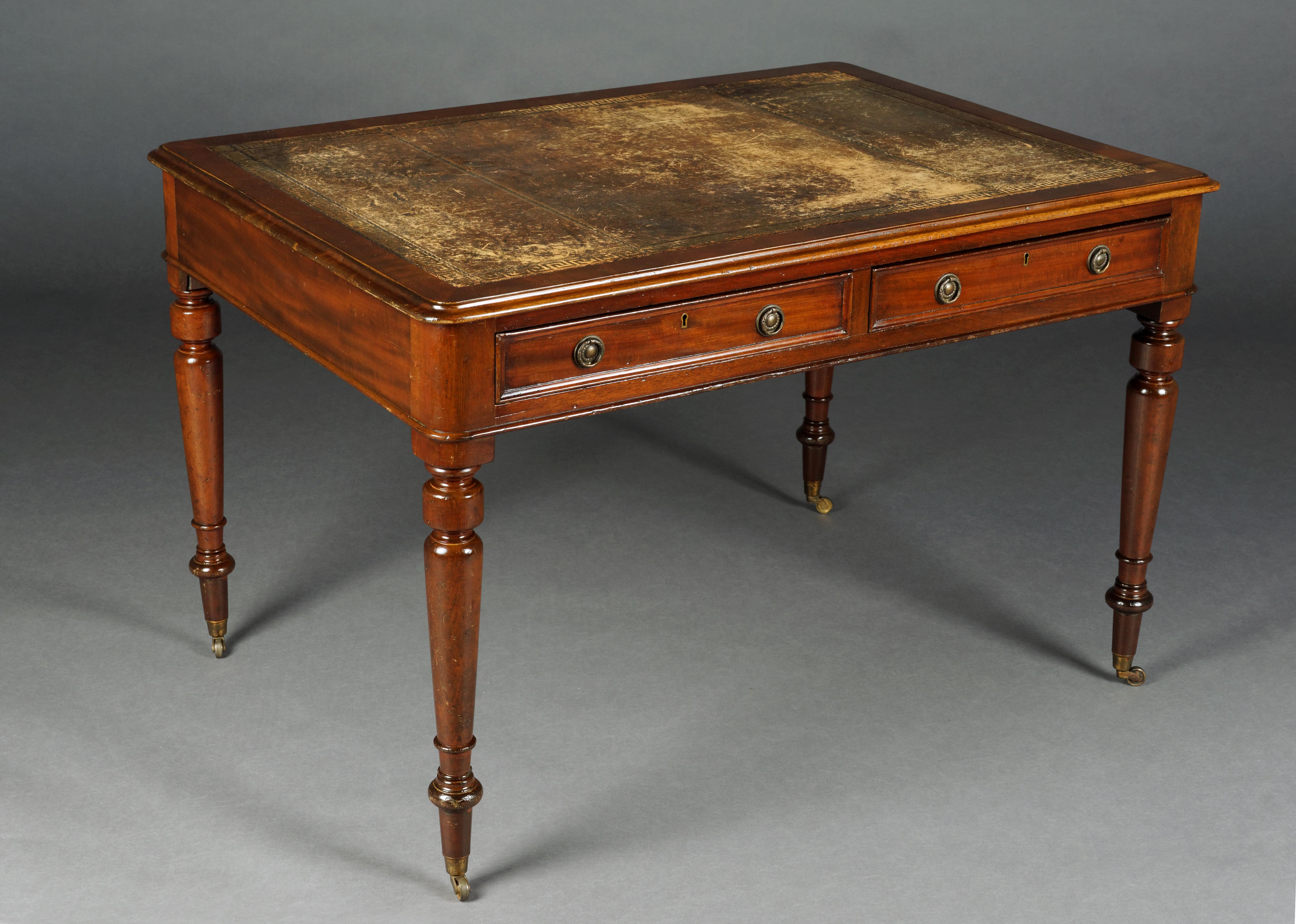 Victorian double desk, England, circa 1850

 On both sides profiled two-chambered frame box on balustrade-shaped legs ending in rolling feet, slightly protruding tabletop. Writing surface with exceptional gold embossed. Decorative brass fittings