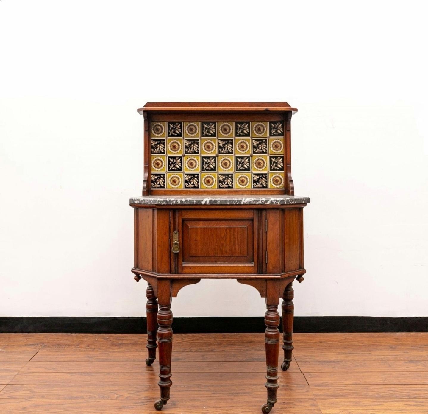 A charming antique Victorian era Eastlake style wash stand. circa 1880

Late 19th century, crafted of warm rich solid walnut with attractive grain detail, featuring a raised gallery with narrow shelf above a highly decorative inset floral and