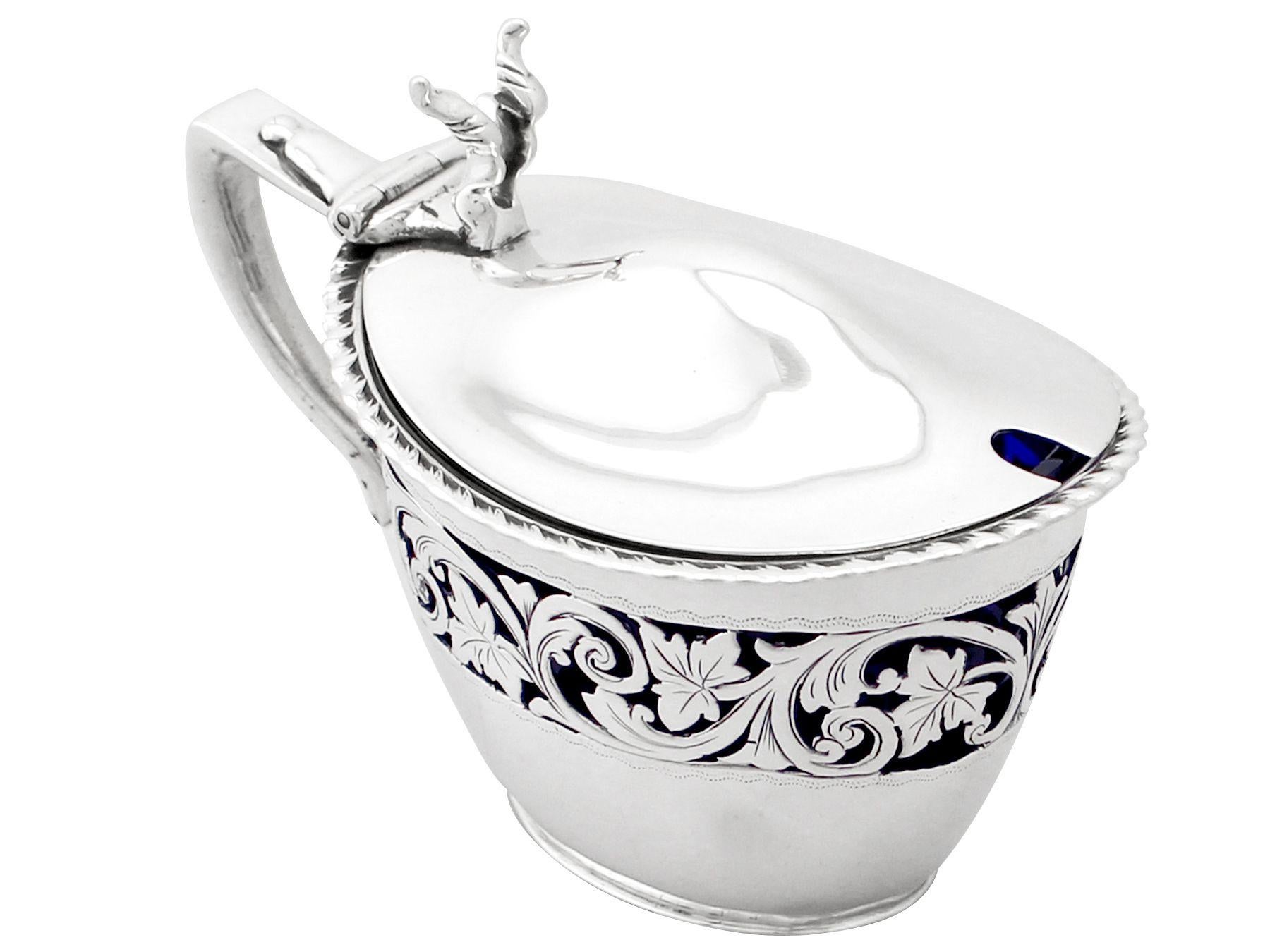 A fine and impressive antique Victorian English sterling silver mustard pot; an addition to our silver cruets/condiments collection.

This exceptional antique Victorian sterling silver mustard pot has an oval tapering form.

The body of the