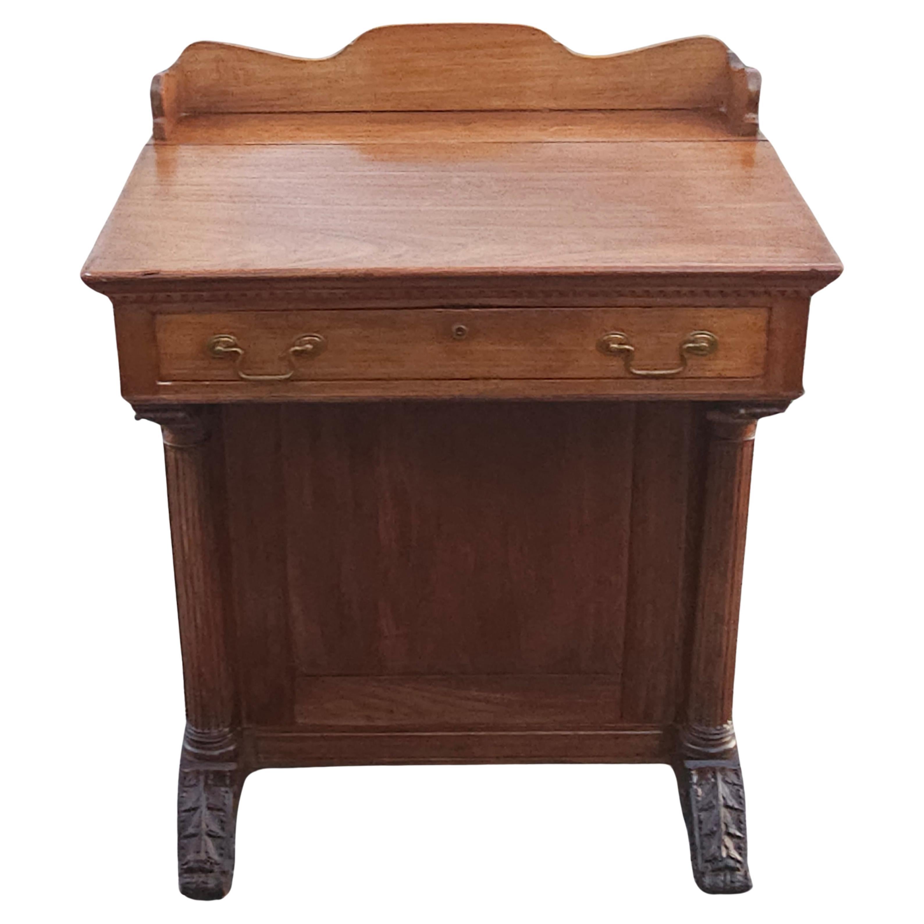 A 19th Century Victorian 5 drawer Davenport Desk with large storage cabinet. Features 2 drawers on left side and 2 drawers on right side, a large two doors storage cabinet with a door on each side. The front drawer is very large and measures 22
