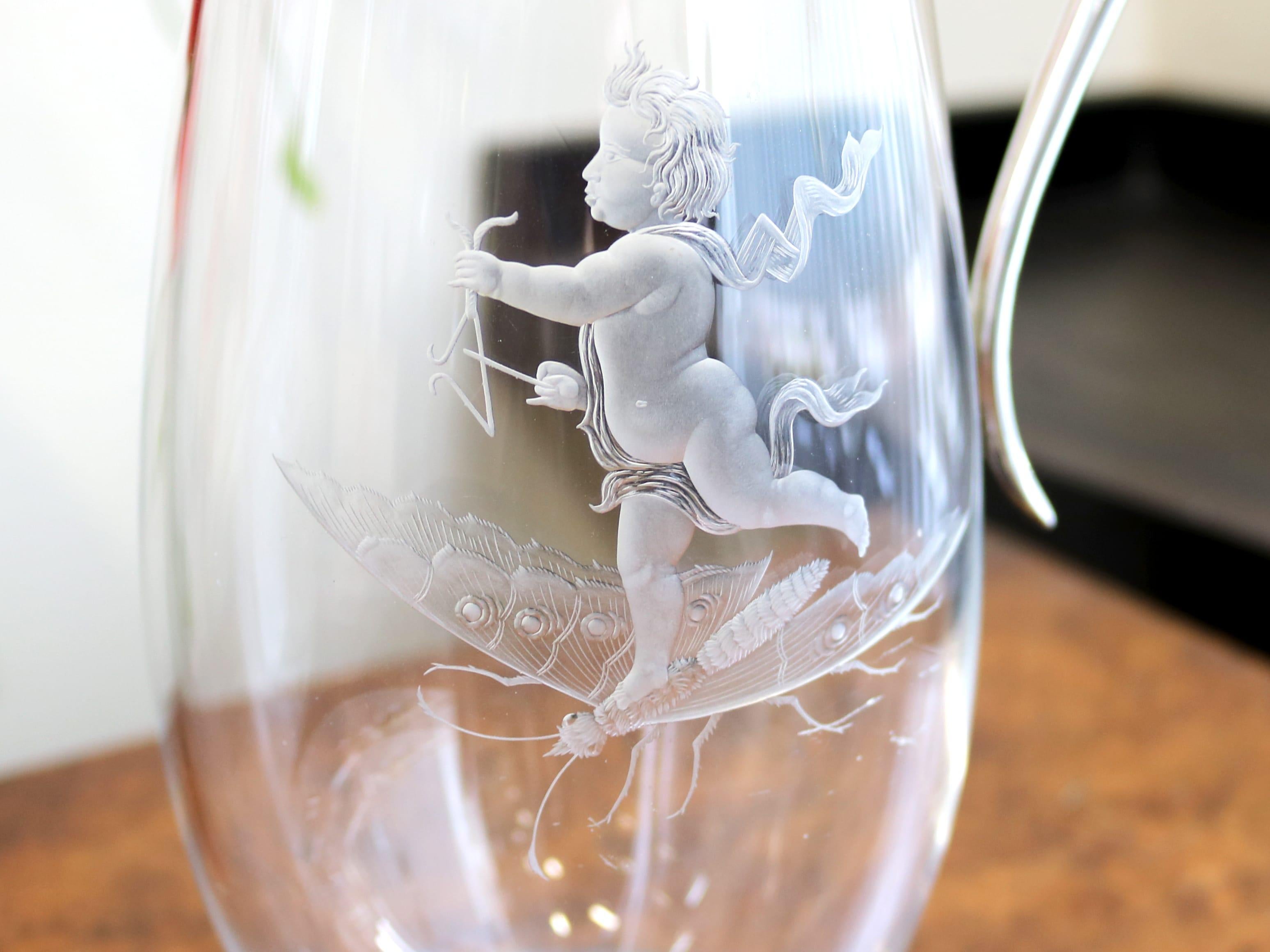 An exceptional, fine and impressive antique Victorian glass and silver mounted claret jug; part of our silver mounted glass collection.

This exceptional antique Victorian glass and sterling silver and glass claret jug has a circular rounded form