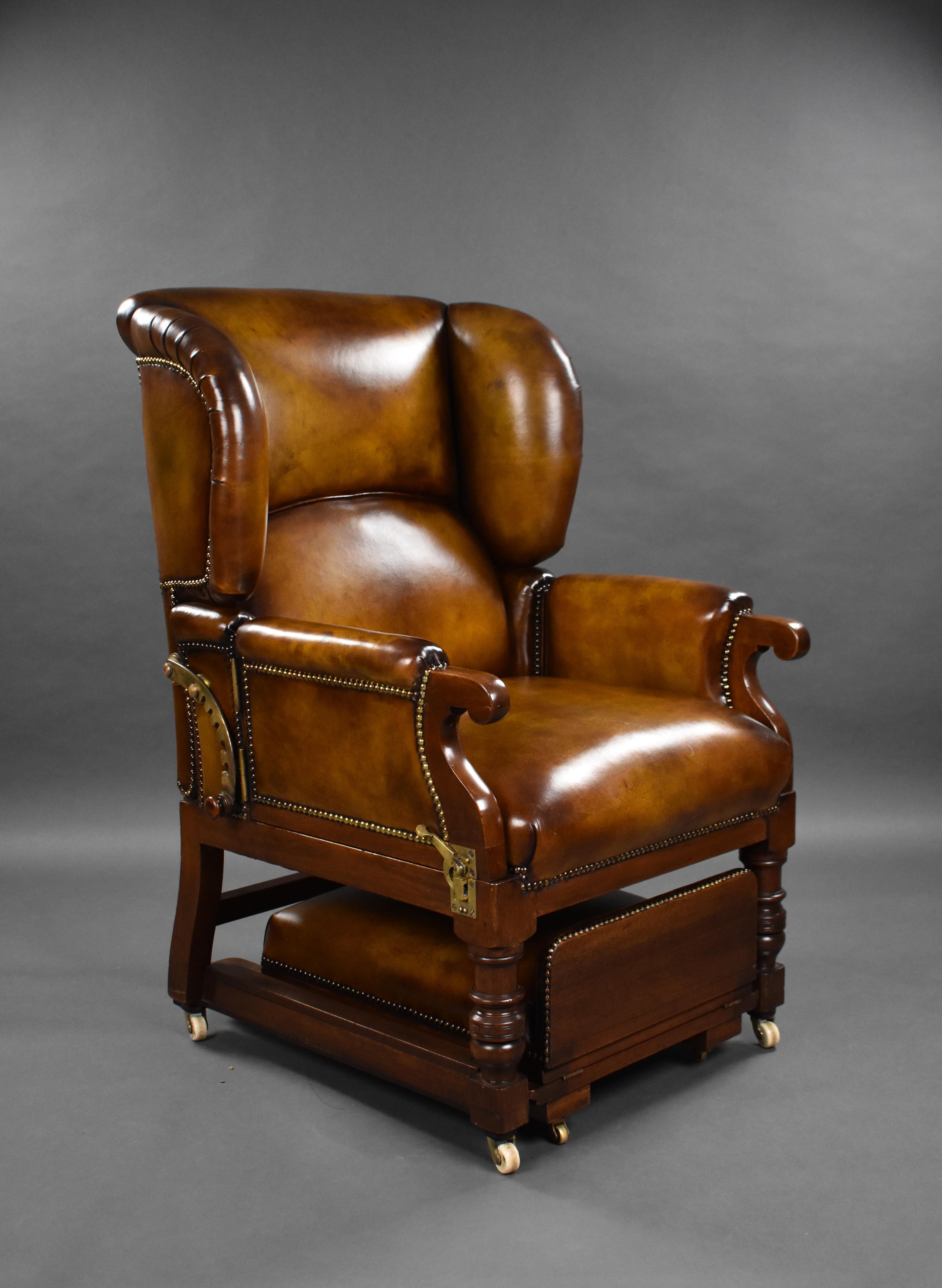 A good quality Victorian leather reclining armchair by Foots Patent Chairs. Having a reclining back, and two opening arms, above a pull out adjustable stool. The chair is in excellent condition, having been upholstered in fine quality leather hide