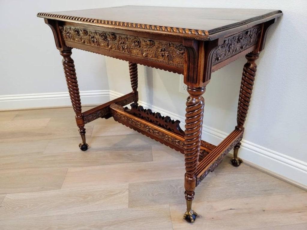 A very fine 19th century Victorian parlor table, profusely hand carved, ornate heavily decorated and finished on all sides, with rich nicely aged oak patina glow. Having a planked top with gadrooned edge on front and back, intricate relief carved