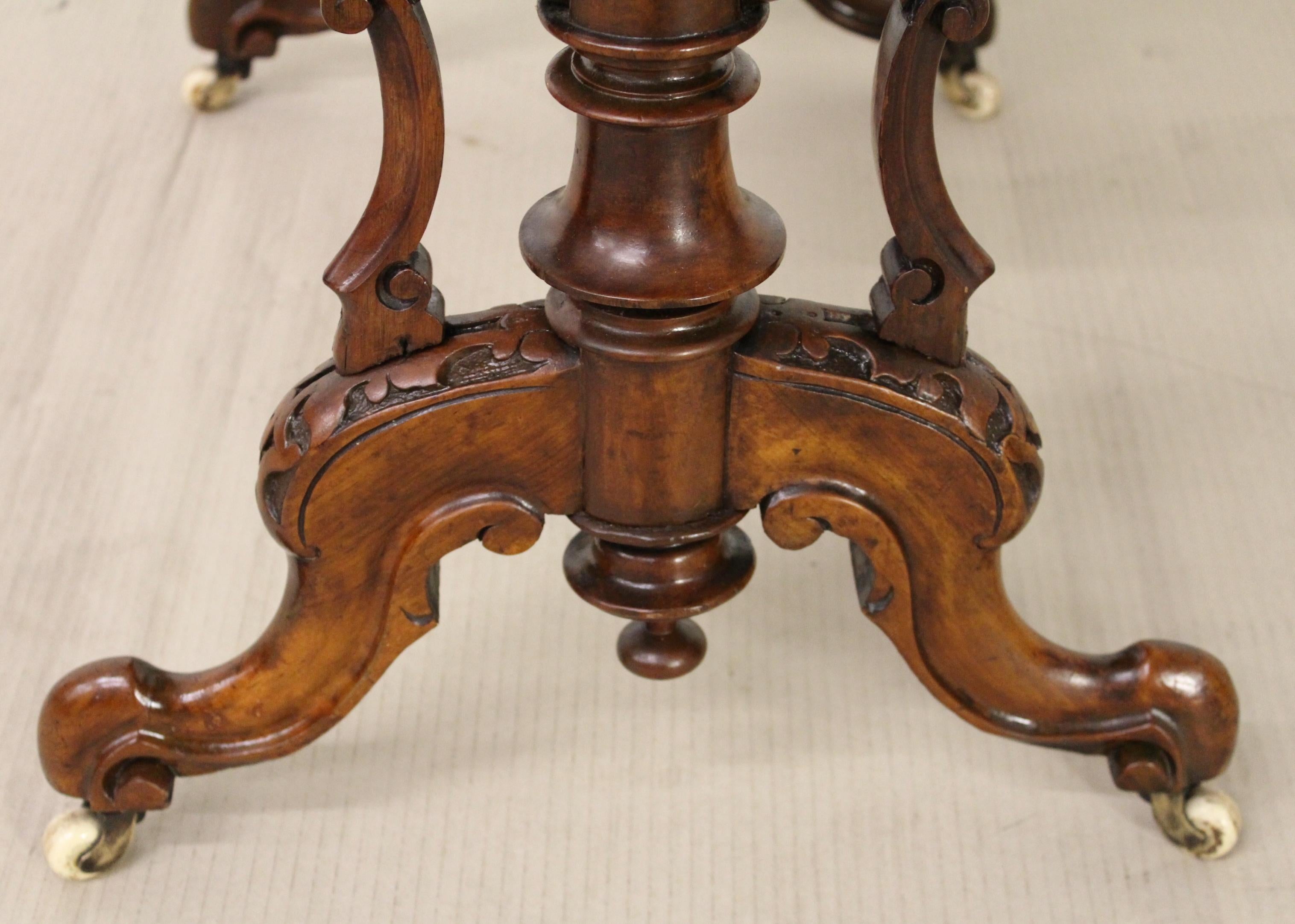A superb quality mid-Victorian period burr walnut work/sewing/writing/table. Very well made in solid walnut with stunning burr walnut veneers. The rectangular top is decorated with Fine inlaid detailing and surrounded with a crisply carved gadrooned