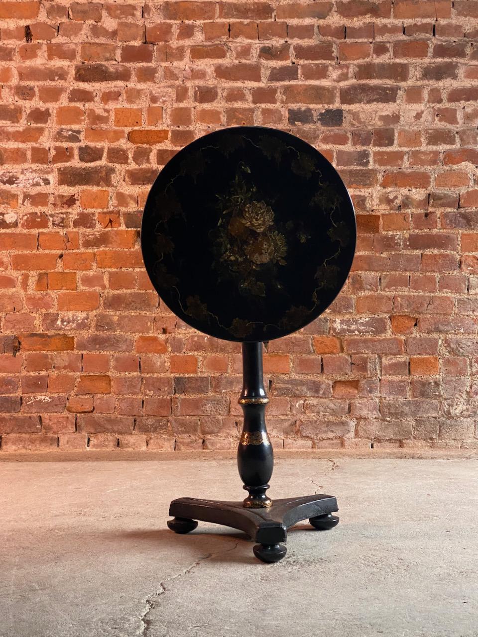 Magnificent 19th century Victorian Japanned lacquer and papier-mâché tilt-top side table circa 1890, the entire ebonized and richly decorated with circular tilt-top , hand painted still life depicting flowers, the table with a turned stem