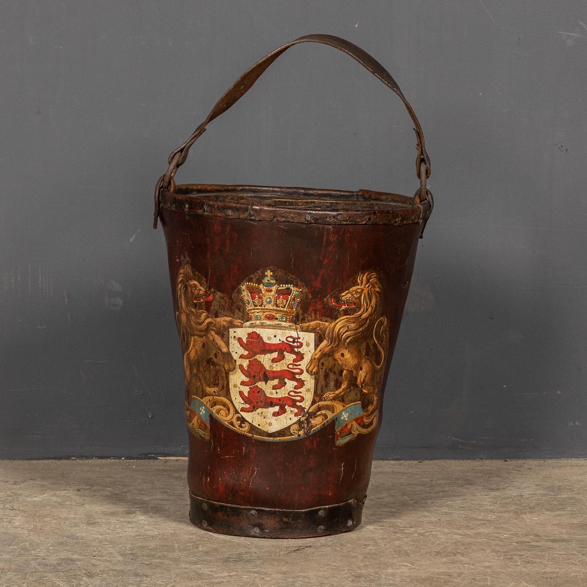 Antique 19th Century Victorian crested leather fire bucket, with rich patina and an Armorial crest with the original handle and studwork

CONDITION
In Great Condition - some wear consistent with light use.

SIZE
Height: 39.5cm
Width: 32.5cm
Depth: