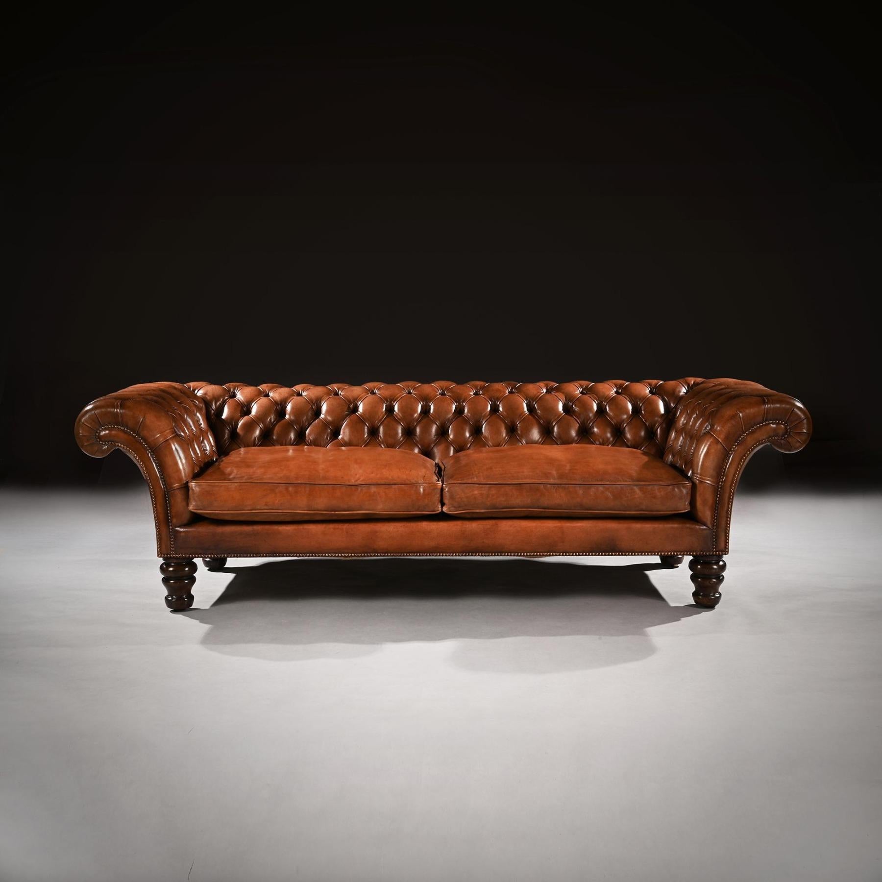 An exceptionally well drawn 19th century Victorian tufted tan / brown leather upholstered Chesterfield sofa, on solid rosewood turned legs.



English Circa 1860.



This extremely elegant Victorian chesterfield sofa stands at 8 feet wide,