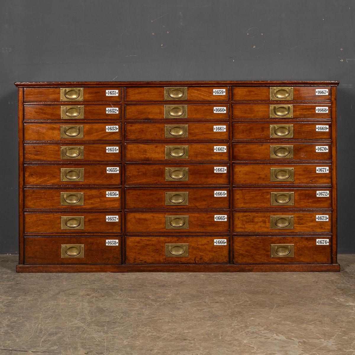 Antique late-19th Century Victorian mahogany bank drawers, this piece has 24 retractable drawers with original brass campaign handles and enamelled labels.

CONDITION
In Great Condition - wear as expected.

SIZE
Height: 80cm
Depth: 134cm
Depth: 34cm