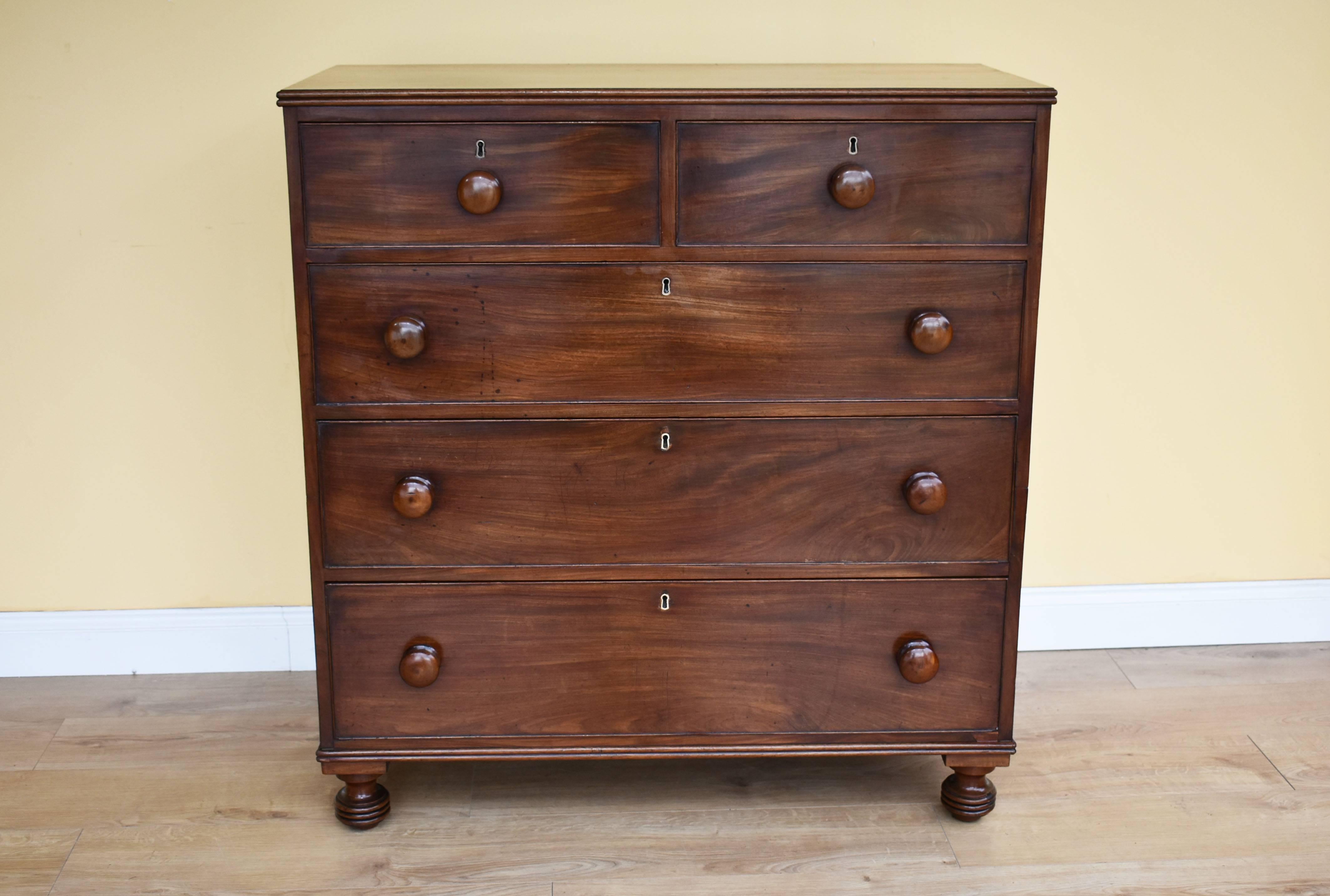 For sale is a good quality mid-Victorian mahogany chest of drawers. The chest has an arrangement of five drawers, two short at the top over three long drawers below, each with bun handles. The chest has been made in the military style, and therefore