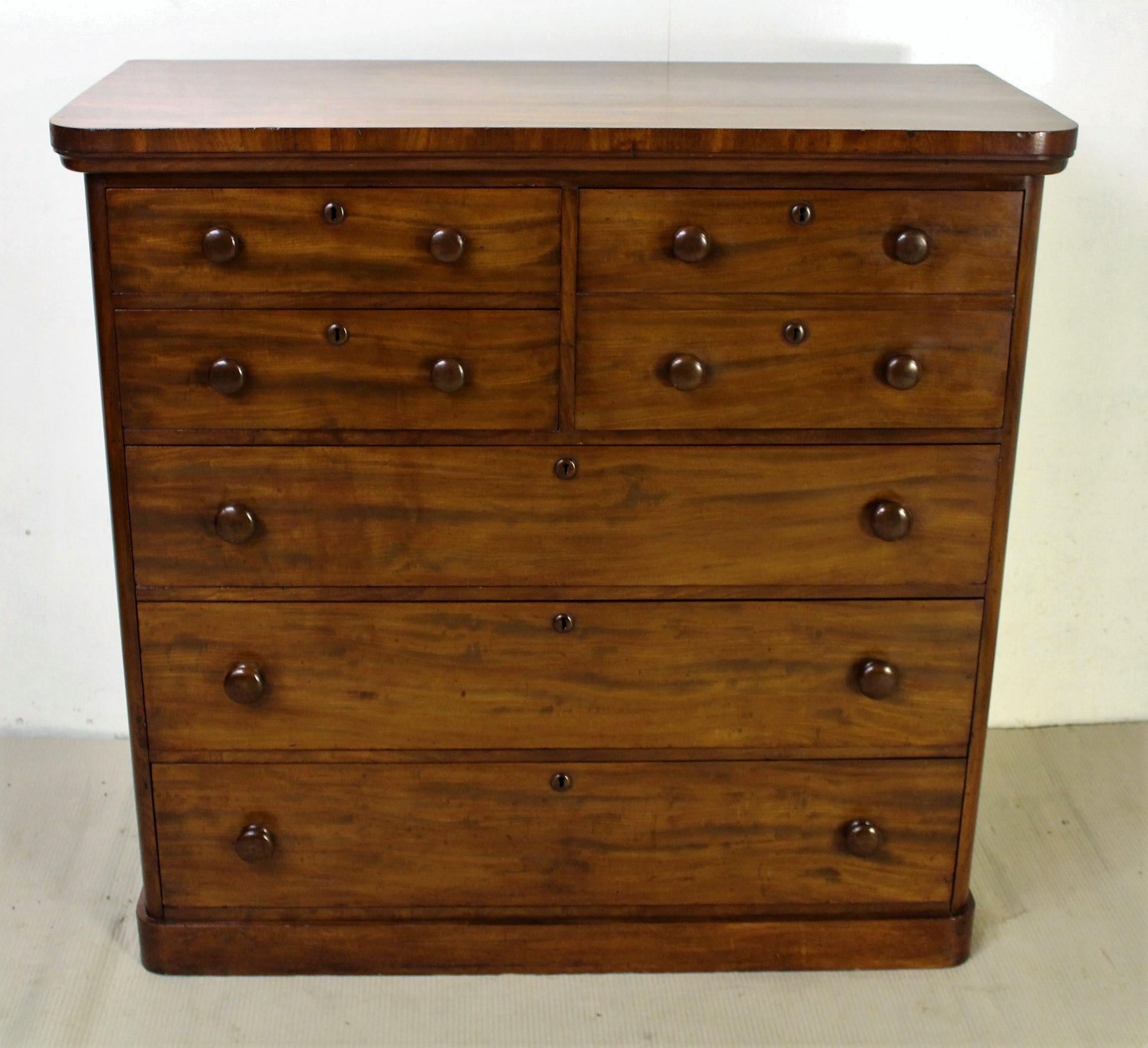 An excellent mid-Victorian period mahogany chest with an unusual arrangement of drawers. Very well constructed in solid mahogany with attractive mahogany veneers. Rather than the usual configuration of 2 short over 3 long drawers, this chest has 3
