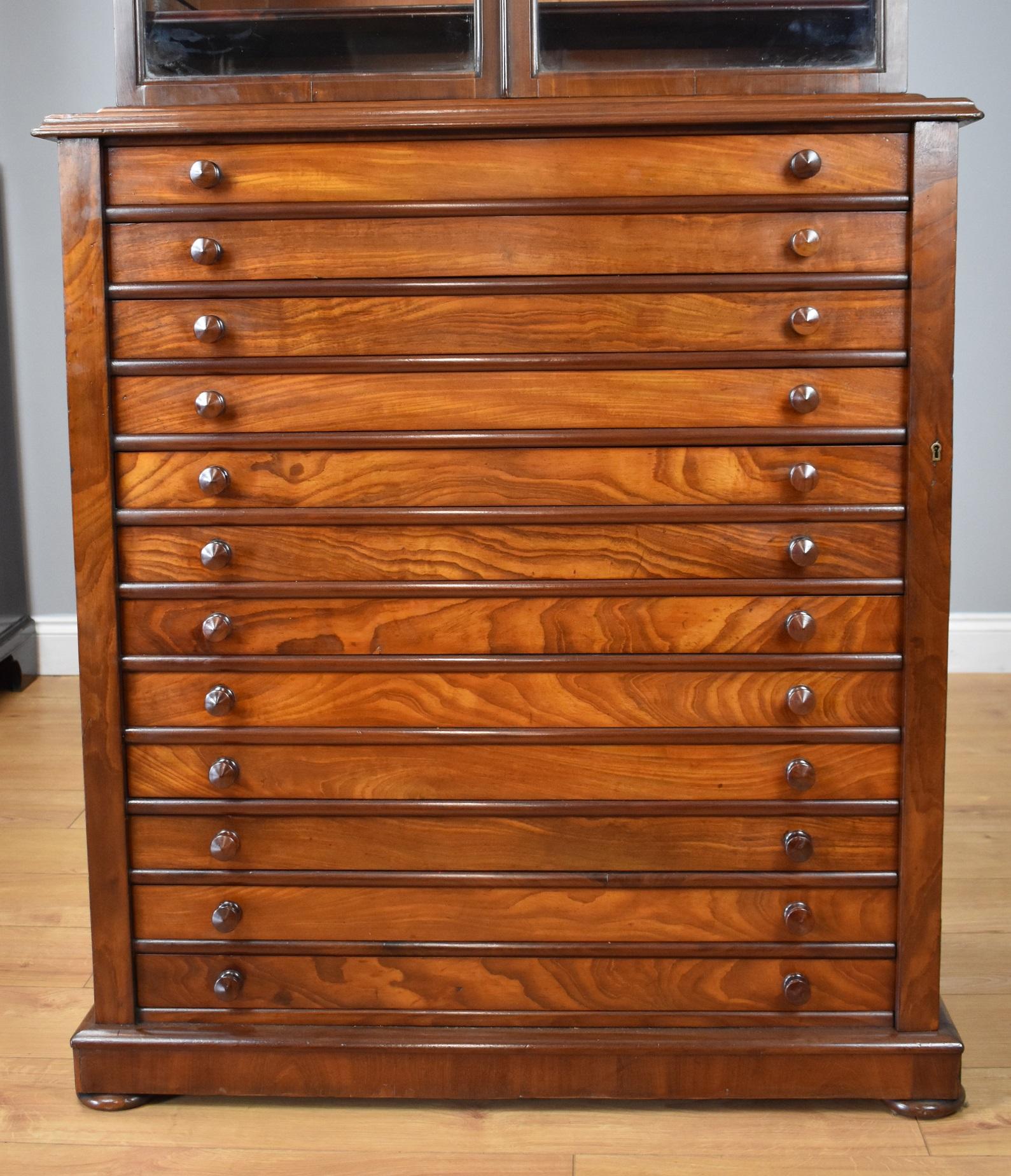 For sale is a good quality 19th century Victorian mahogany Collectors cabinet by J. Mountford of Bradford Street, Birmingham. Unusually, this piece has a glazed top, opening to reveal three adjustable shelves. Below this, the chest has 12 deep